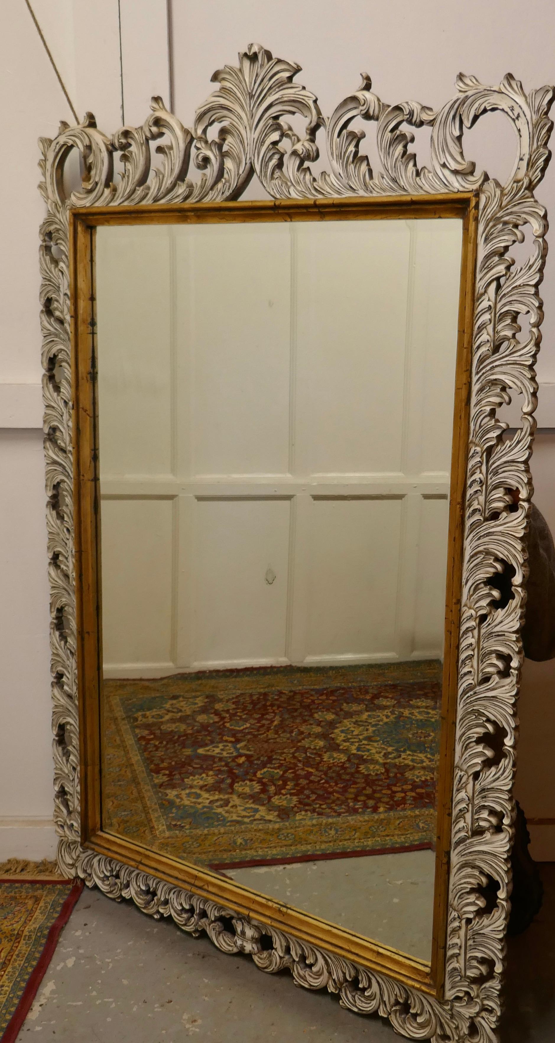 20th Century Large Heavily Carved Fruitwood Distressed Paint Mirror