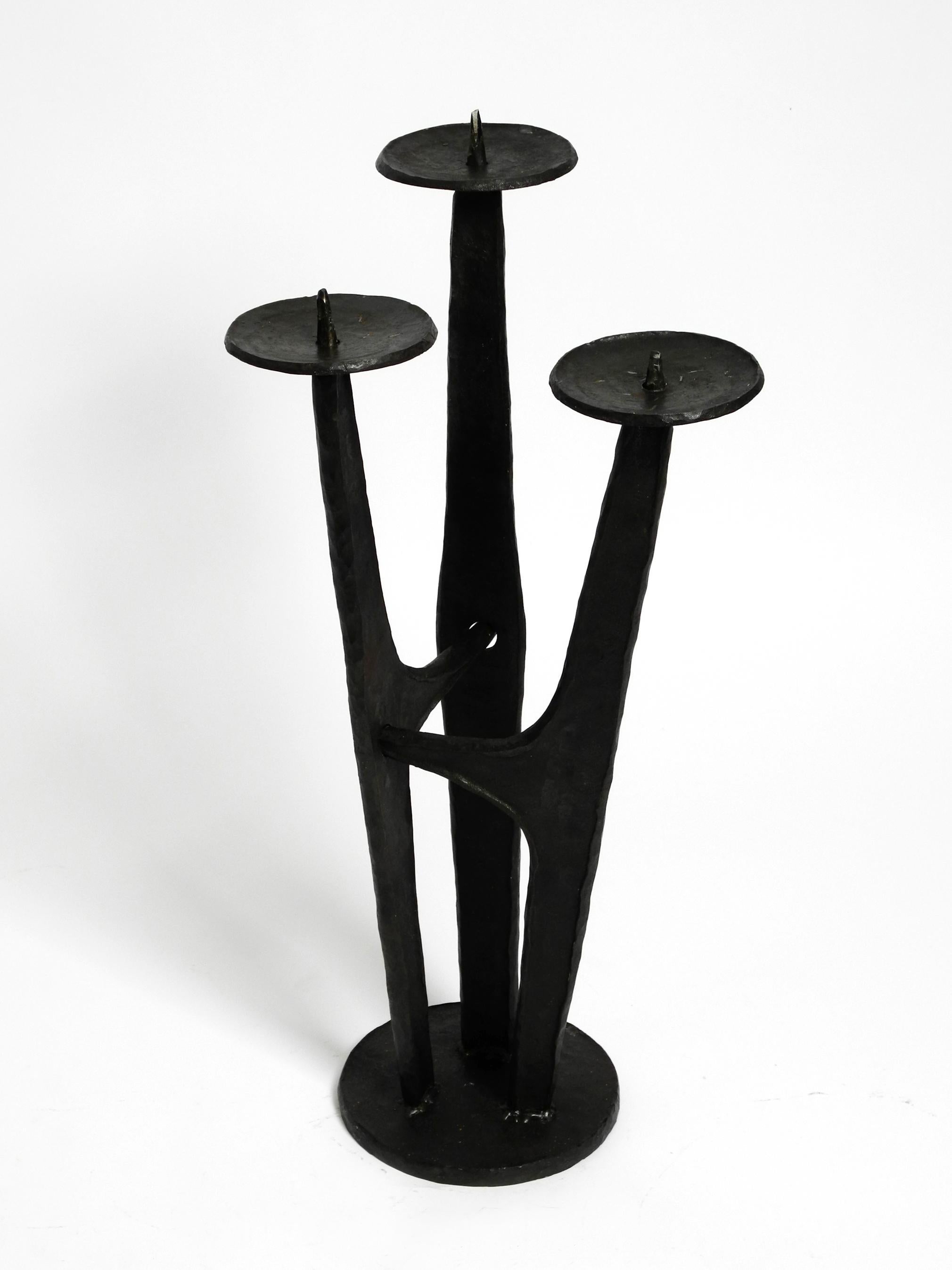 German Large, heavy 50s floor candle holder made of wrought iron in Mid Century design For Sale