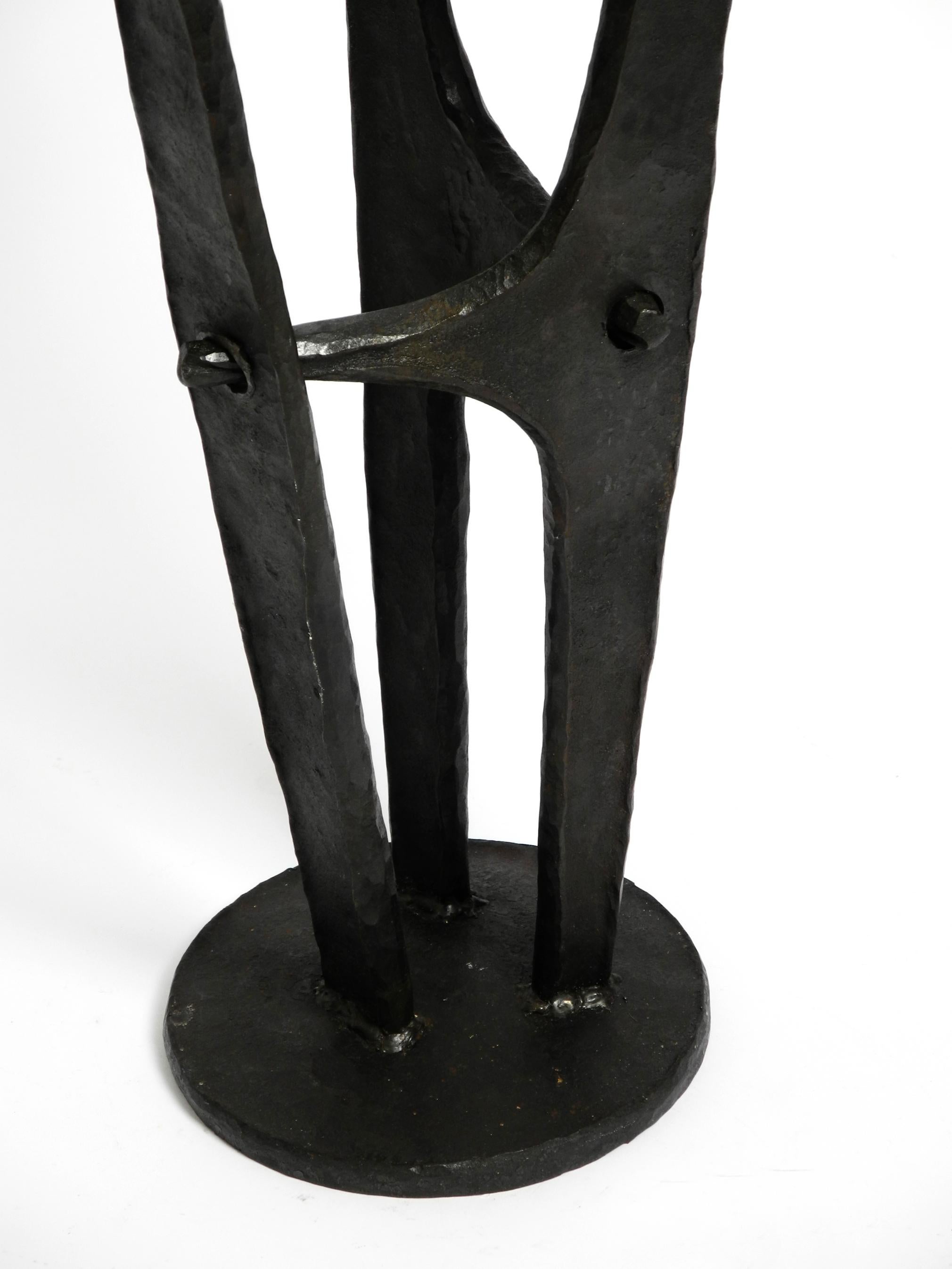 Iron Large, heavy 50s floor candle holder made of wrought iron in Mid Century design For Sale
