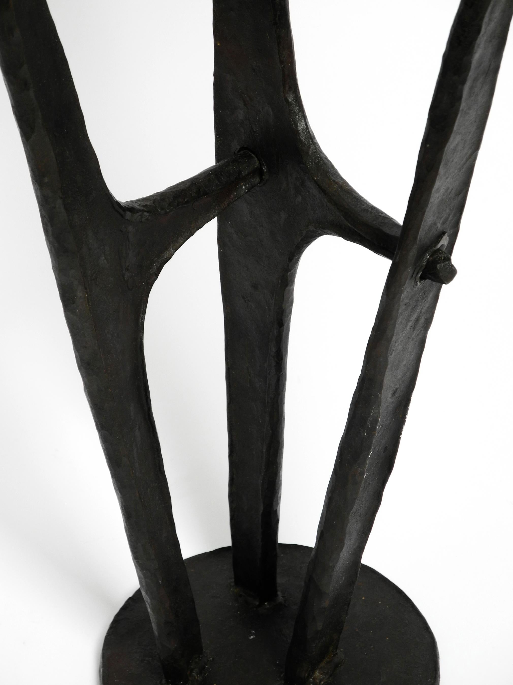 Large, heavy 50s floor candle holder made of wrought iron in Mid Century design For Sale 1