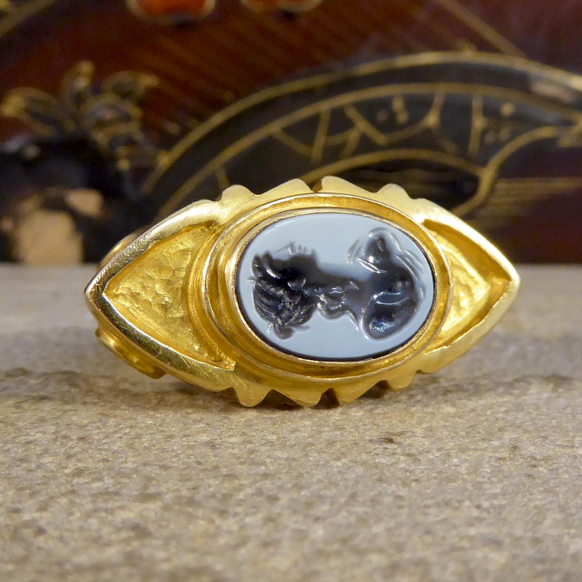 This heavy antique ring is very large in size hand crafted in the Victorian era. It features Carved Agate in the centre depicting a females silhouette in a rob over setting. Fully made from 18ct Yellow Gold, this ring has a beautiful gallery and
