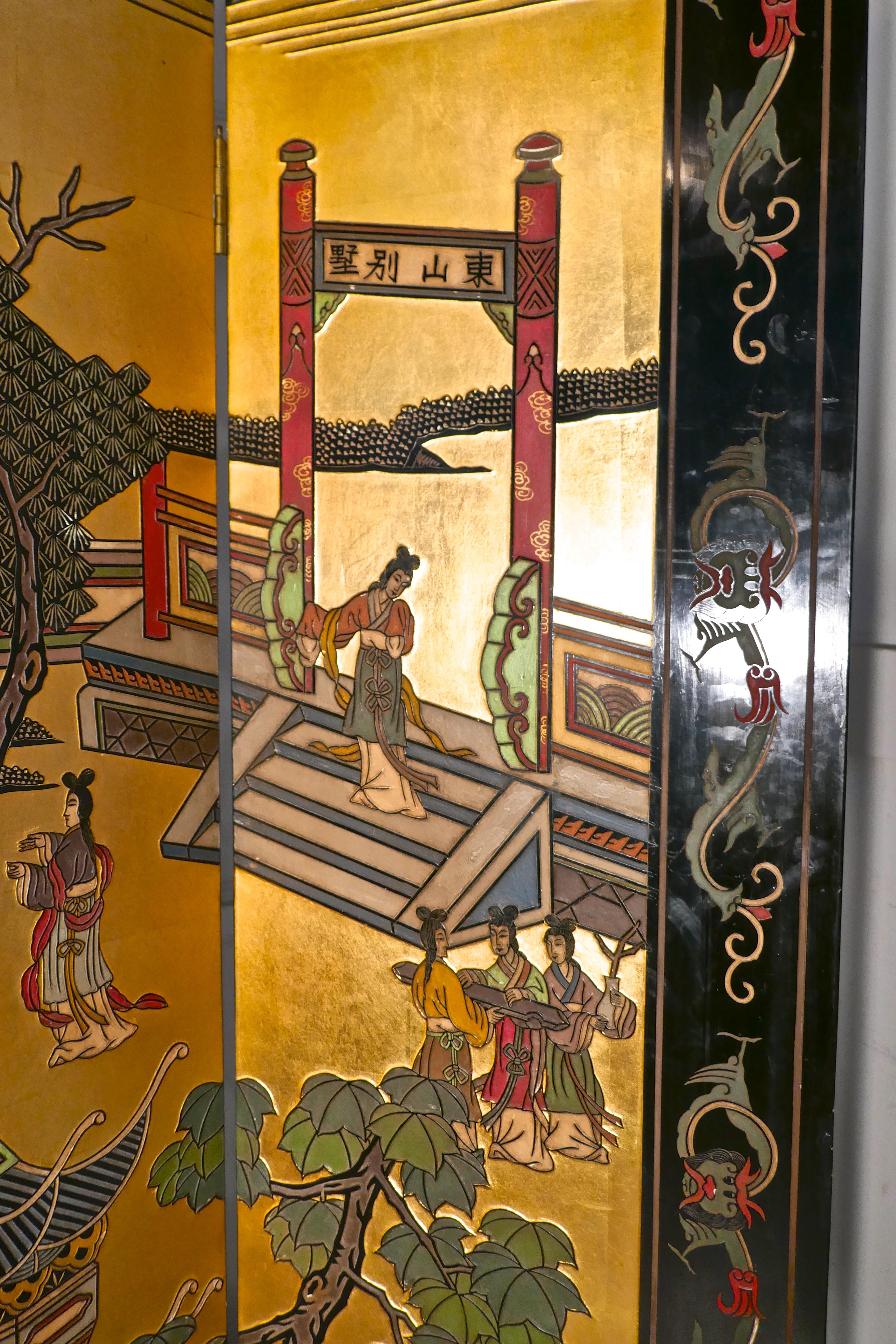 Large heavy decorated Japanese lacquer room divider screen

This impressive screen has four superbly decorated panels, if the screen is opened flat the picture on one side continues through the panels. The picture show an outdoor scene with