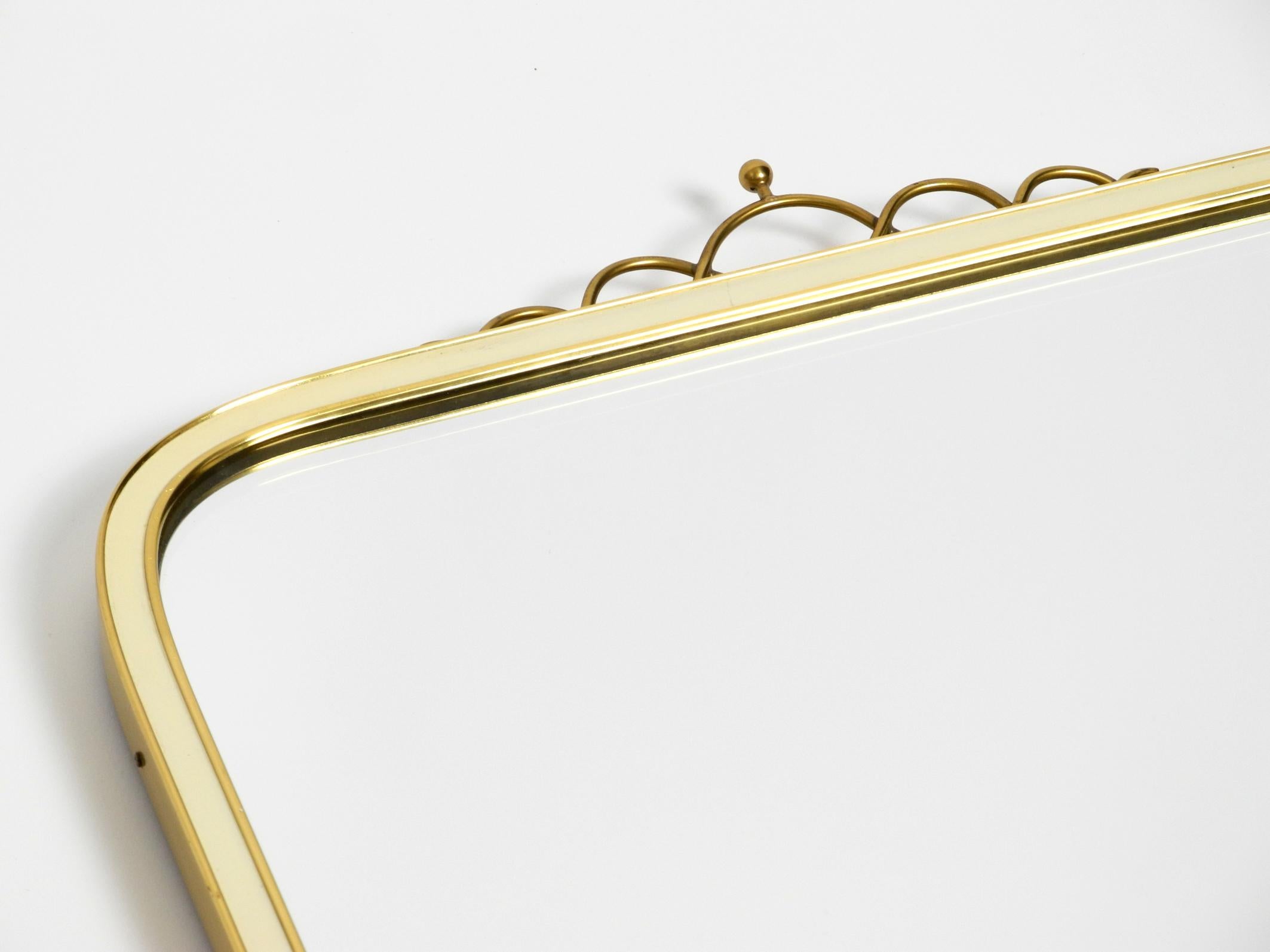 Large heavy long Mid Century brass wall mirror by Münchner Zierspiegel For Sale 10