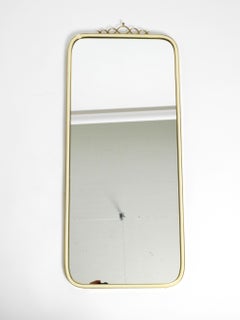Large heavy long Mid Century brass wall mirror by Münchner Zierspiegel