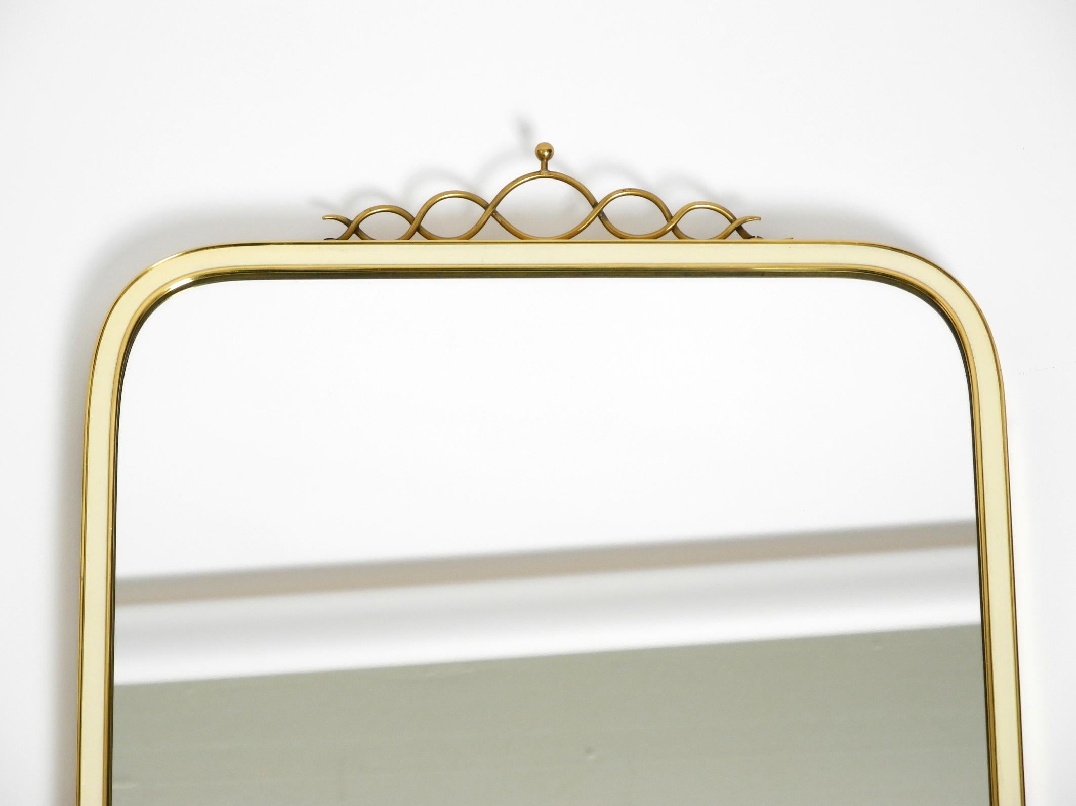 Mid-20th Century Large heavy long Mid Century brass wall mirror by Münchner Zierspiegel For Sale