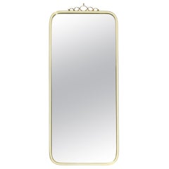 Large heavy long Mid Century brass wall mirror by Münchner Zierspiegel