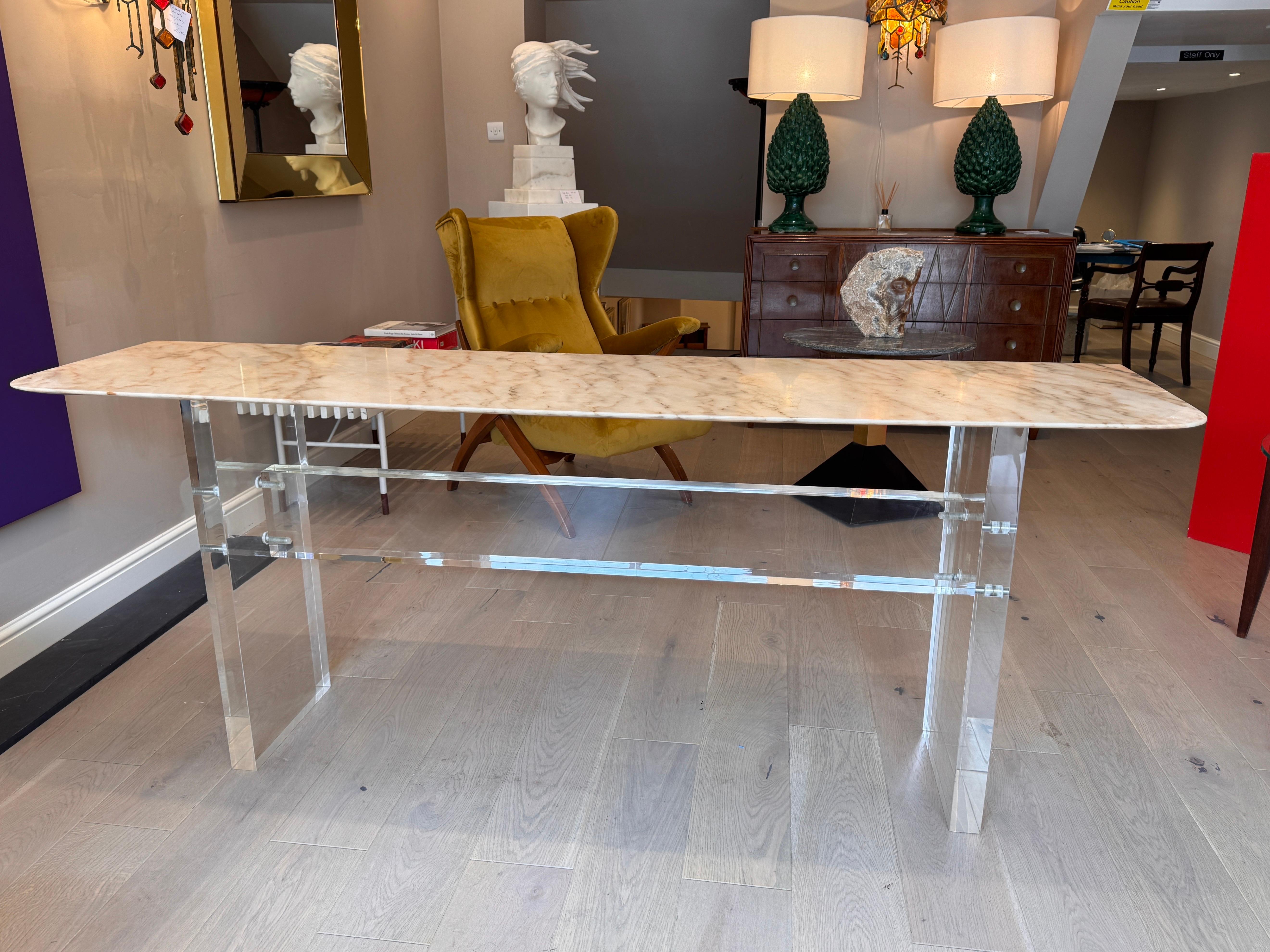 An impressive 50mm (2inches) thick lucite & bevelled Carrara marble sofa/console table . Produced in Italy C1960s . 
Measurement including the marble top . 
H.77cm (30.5inches) X W195cm (77inches) X D48cm ( 19inches) 
