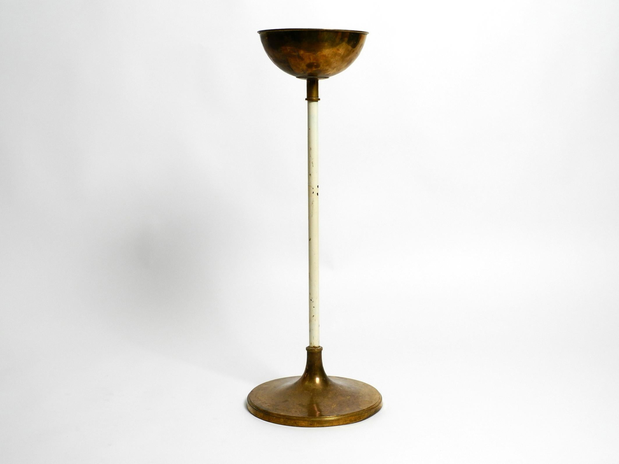 Beautiful large heavy Mid-Century Modern brass holy water stand by Vereinigte Werkstätten.
Manufactured by Vereinigte Werkstätten in the 1950s. Made in Germany.
Design typical for that time. Elaborately and solidly built for eternity.
The brass