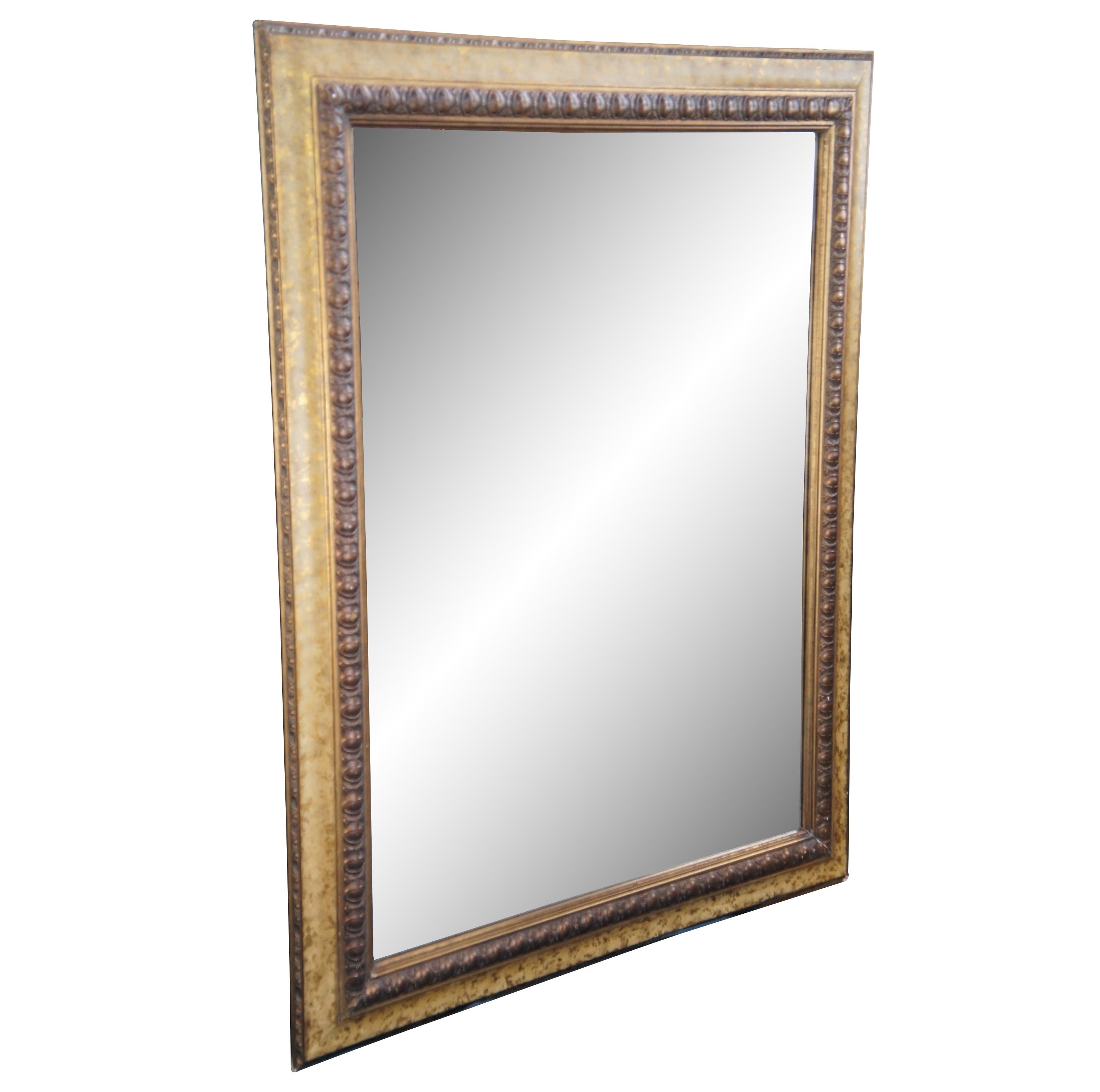 Large vintage beveled mirror featuring gold and baroque accents. Can hang both vertical and horizontal.