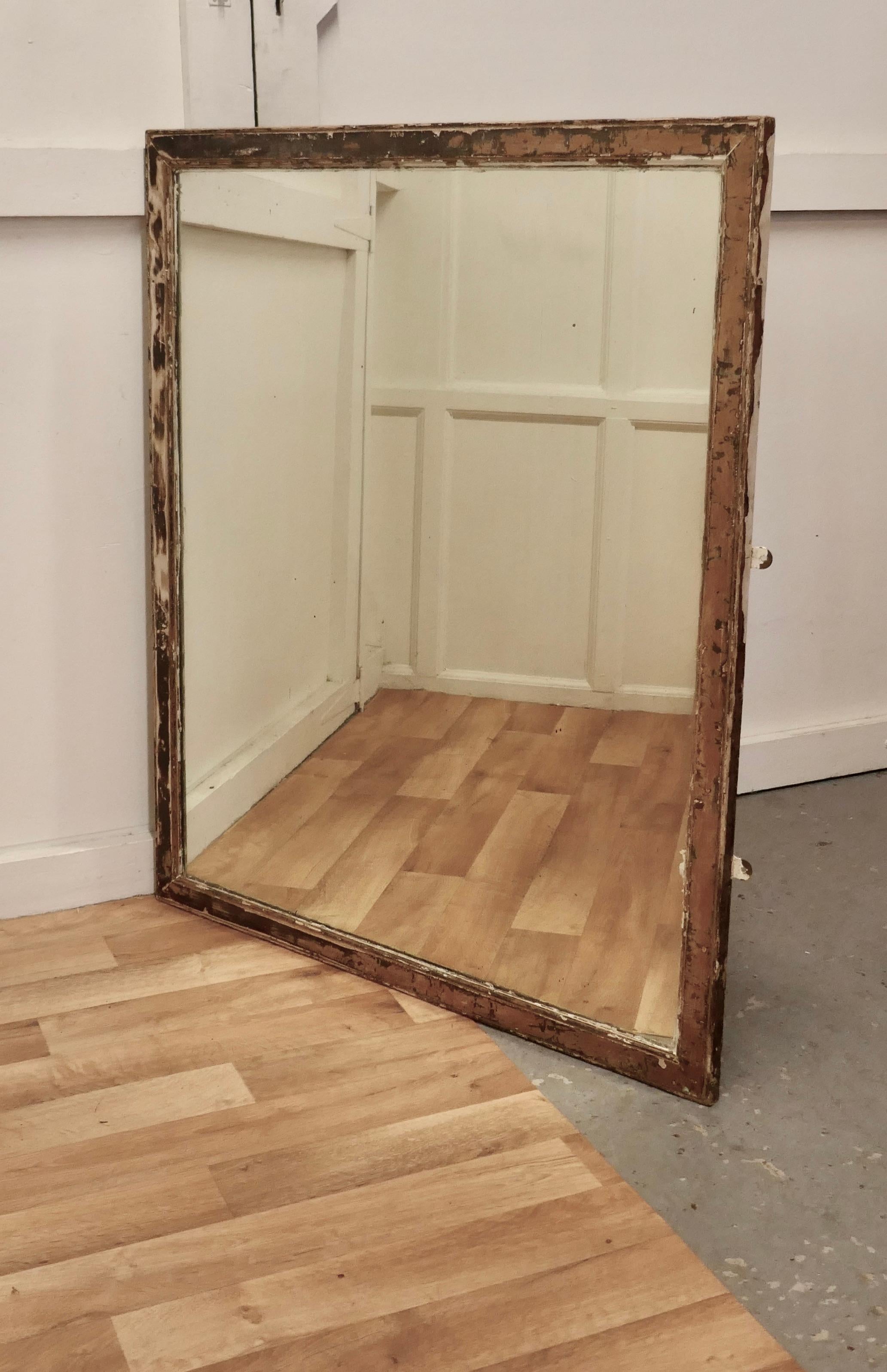 Large heavy Shabby frame wall mirror

This is a charming piece of shabby elegance, the Aged mirror frame is 2” wide and has layers of old paint in various thicknesses 
The old looking glass is entirely original, it has some foxing but this is a