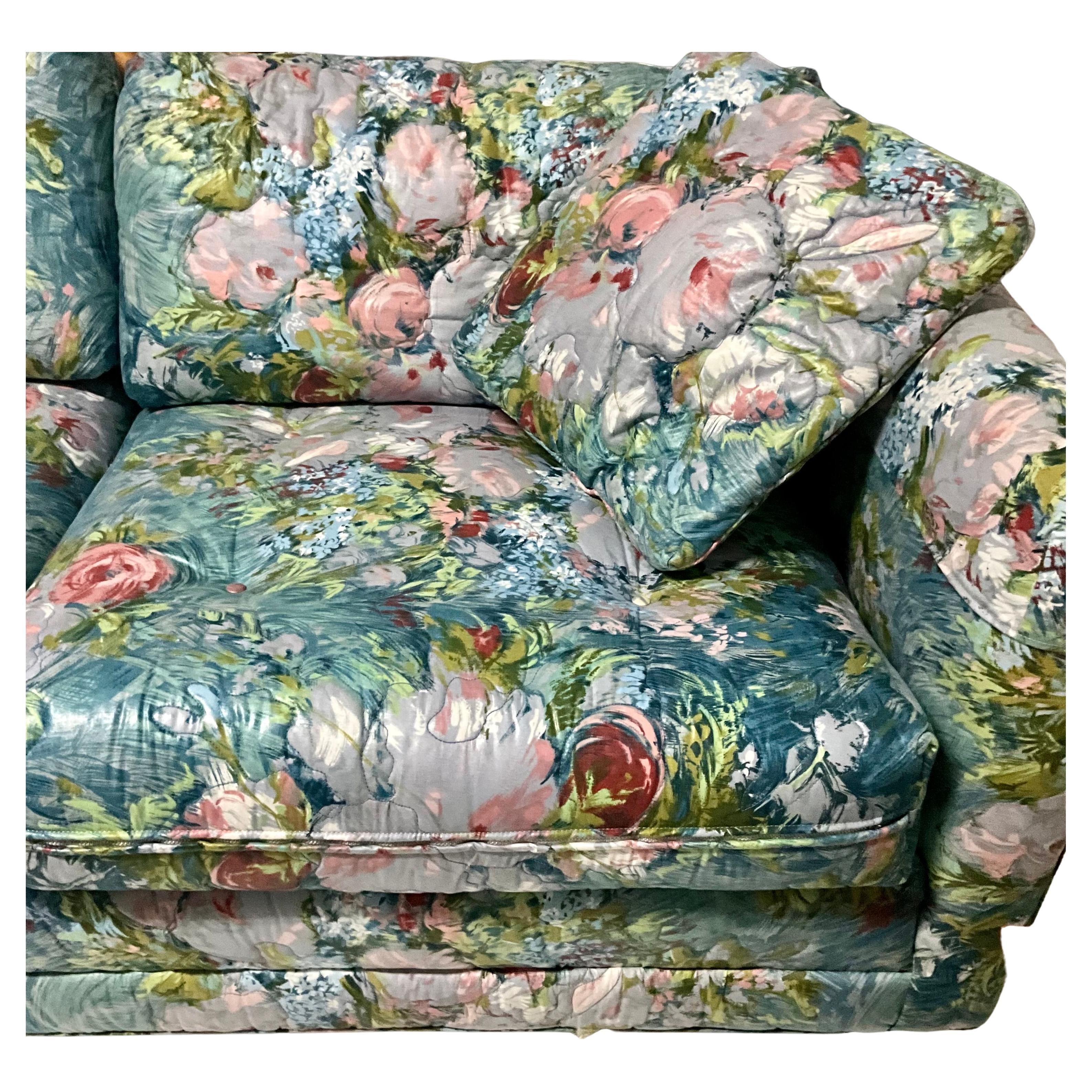 Larger modular sofa by Henredon with a cstunning chintz flowery fabric in blues greens, pinks and whites.  This piece has been kept in excellent vintage condition, barely used.  Can be put together in a variety of different ways.  Labels underneath
