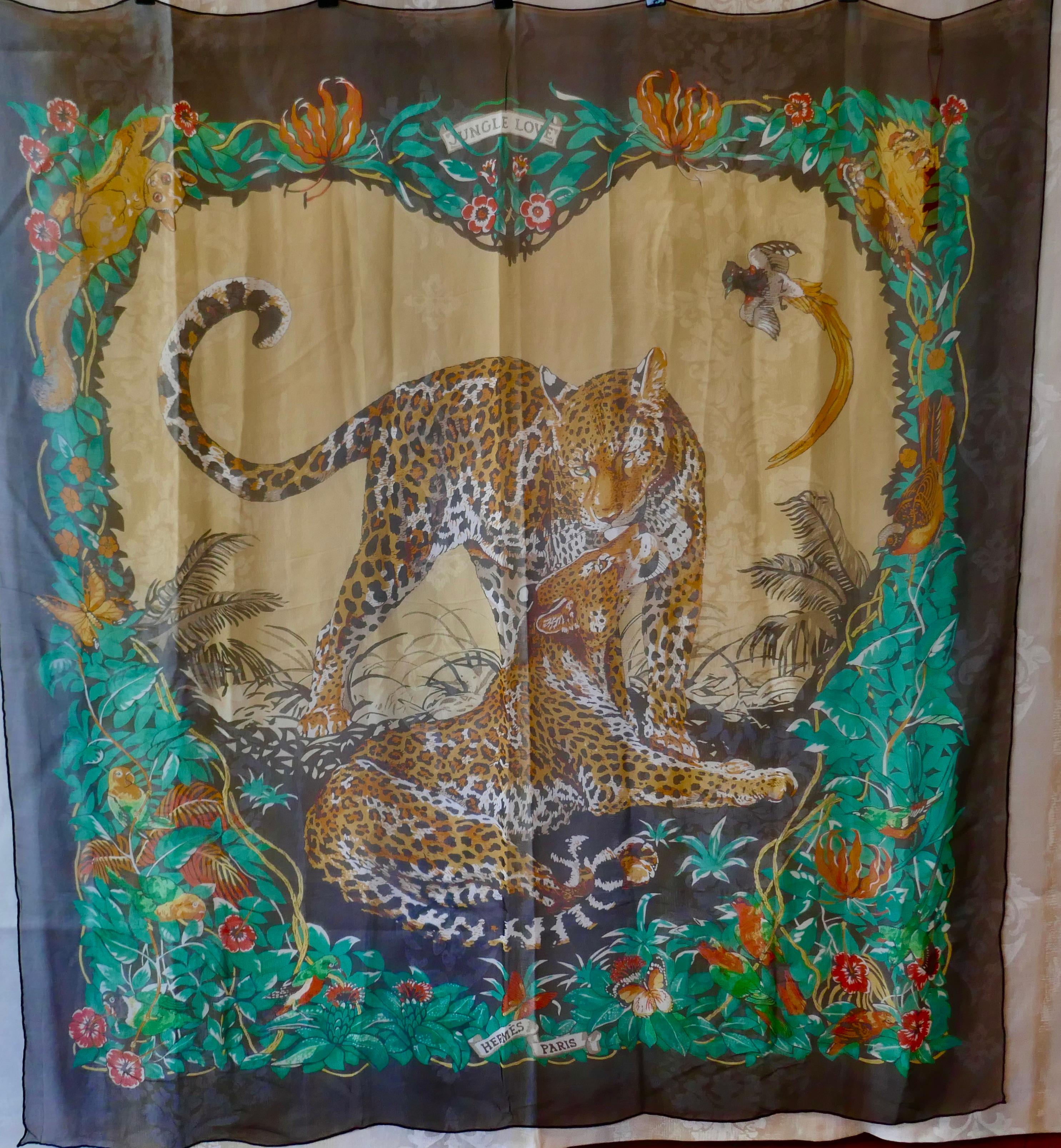 Large Hermes Silk Chiffon Shawl “Jungle Love” Design by Robert Dallet

Very Large, Light and Warm Silk Chiffon Shawl from the year 2000
Love in the heart of the Jungle, leopard style surrounded with flowers and birds
Wonderful design,Very large