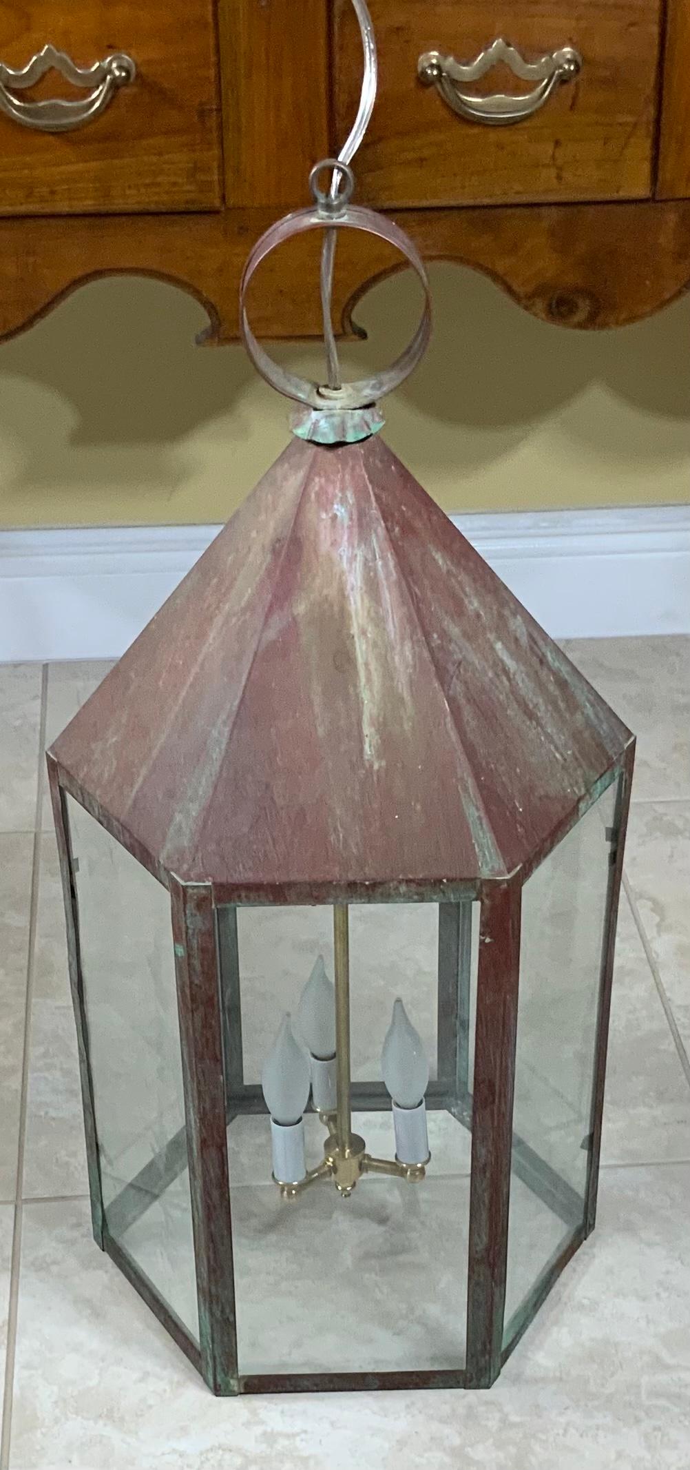 Large architectural six sides lantern made of copper, electrified with three 60/watt light. Up to us code UL approve Suitable for what location 
Copper canopy included.