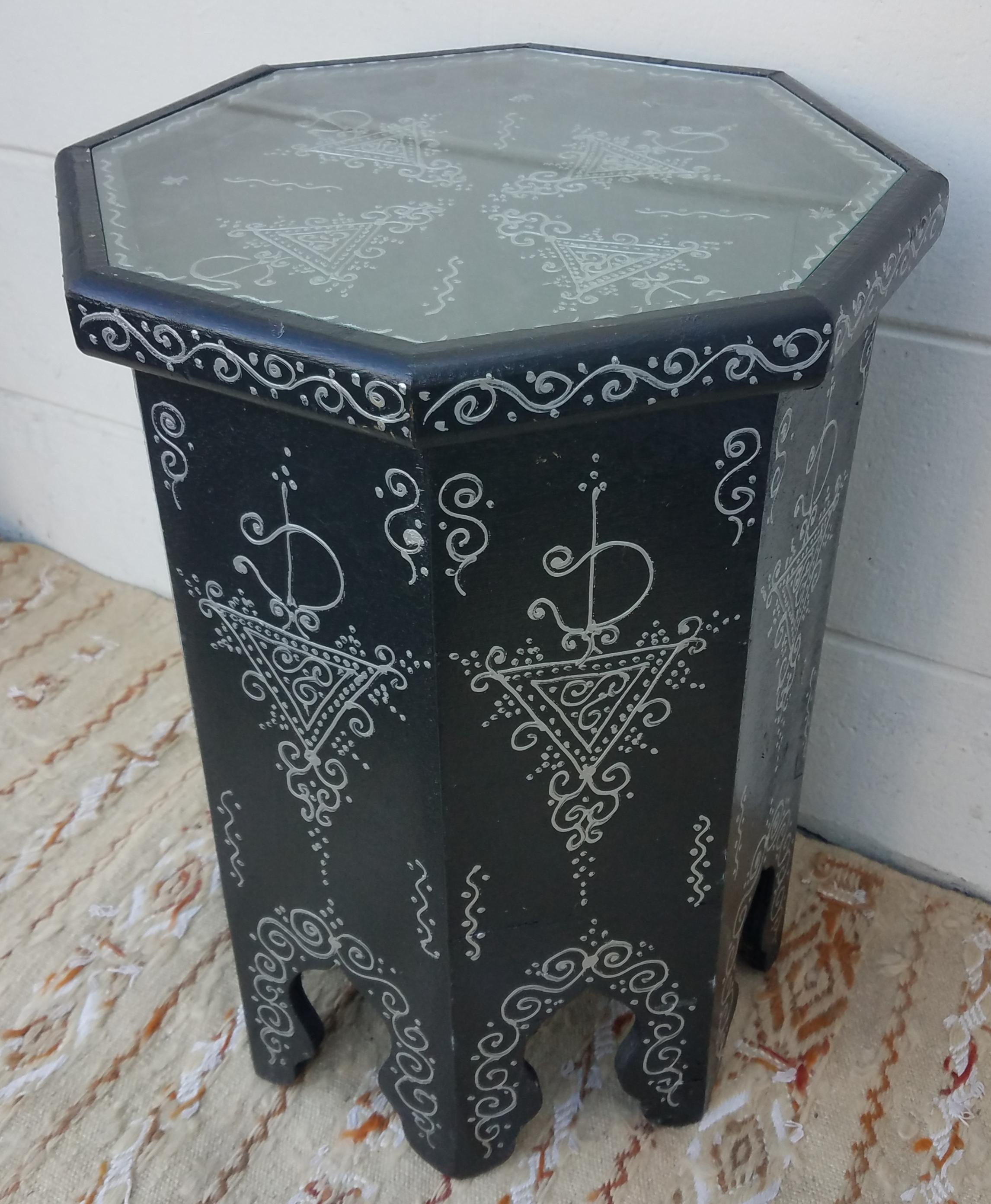 Rare find! 100% hand painted Moroccan hexagonal shape side table. Black base with silver color design patterns. Great handcraftsmanship throughout. Beautiful add-on to your decor. This table measures approximately 20