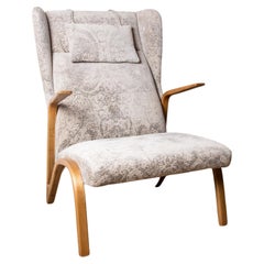Large high armchair in curved beech and recent Konkav fabric model by Paul Bode.