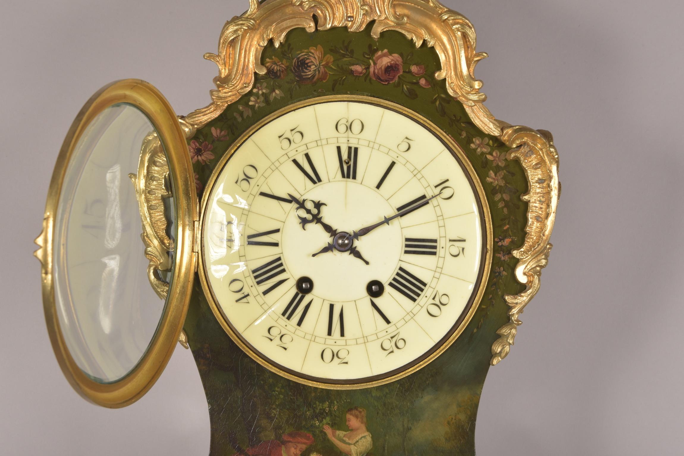 This is a French Cartel clock with console in Vernis Martin. Wood is romantically painted with festive image and flowers. Movement is stamped Vincenti ('medaille d' argent 1855').

This clock comes with key and pendulum.

This clock comes with a