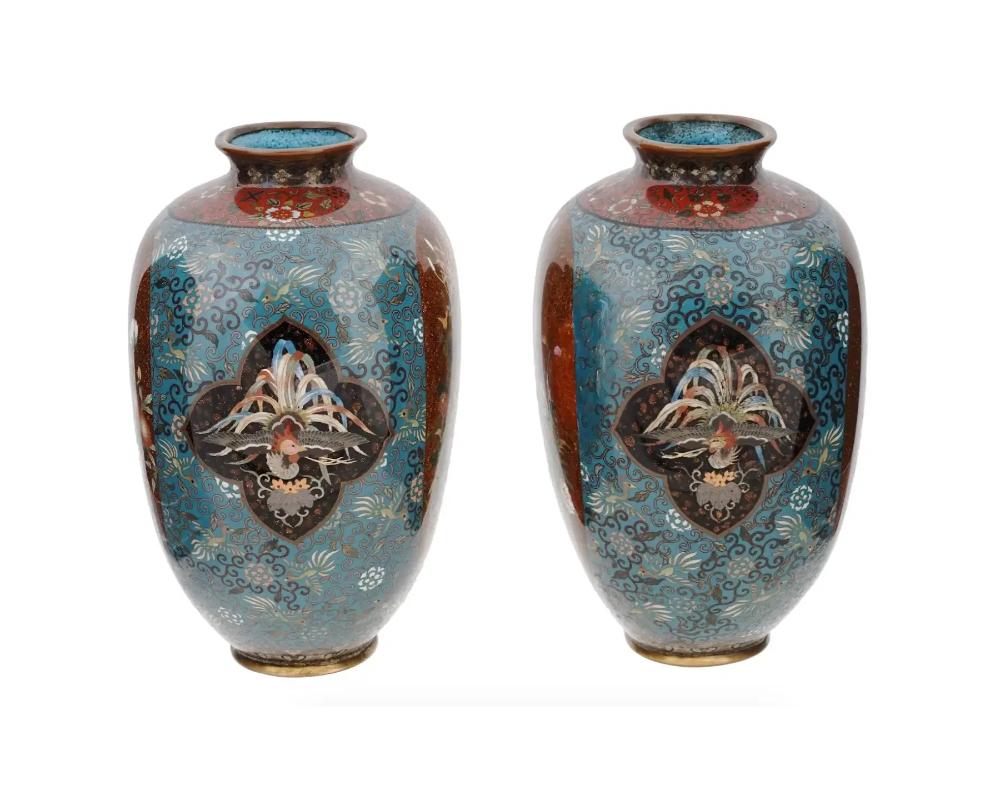 A pair of large high quality Japanese enamel over brass vases
The sphere shaped vases are covered with polychrome enamel medallions depicting sparrows in blossoming flowers, and Phoenix birds surrounded by floral, foliage, Phoenix bird, and