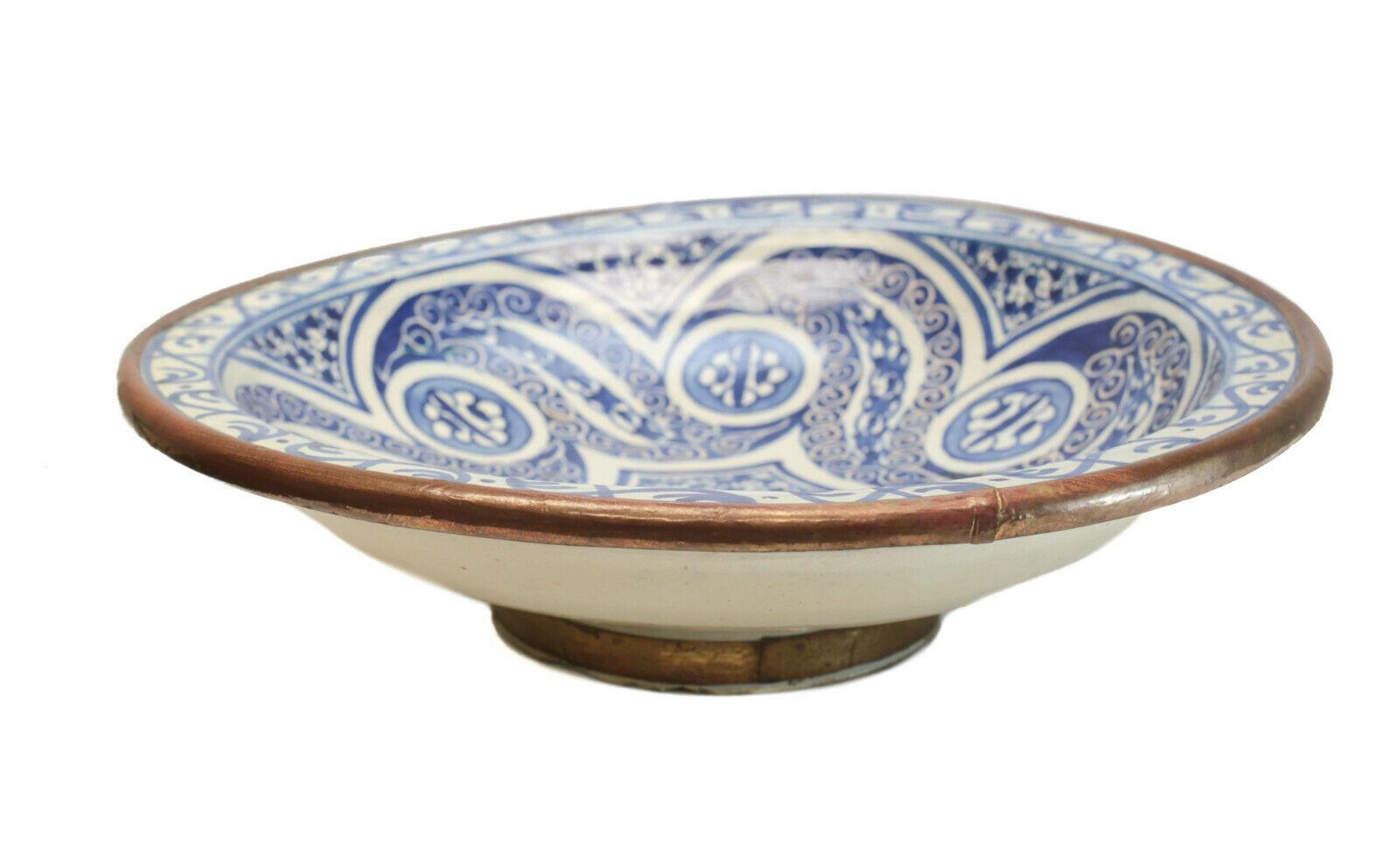 Large Hispano Moresque pottery centerpiece bowl, 19th century or earlier

Blue swirls throughout the center of the bowl.

Additional information:
Age: 19th Century or Earlier 
Type: Bowls
Dimension: 14.75 inches diameter x 3.5 inches