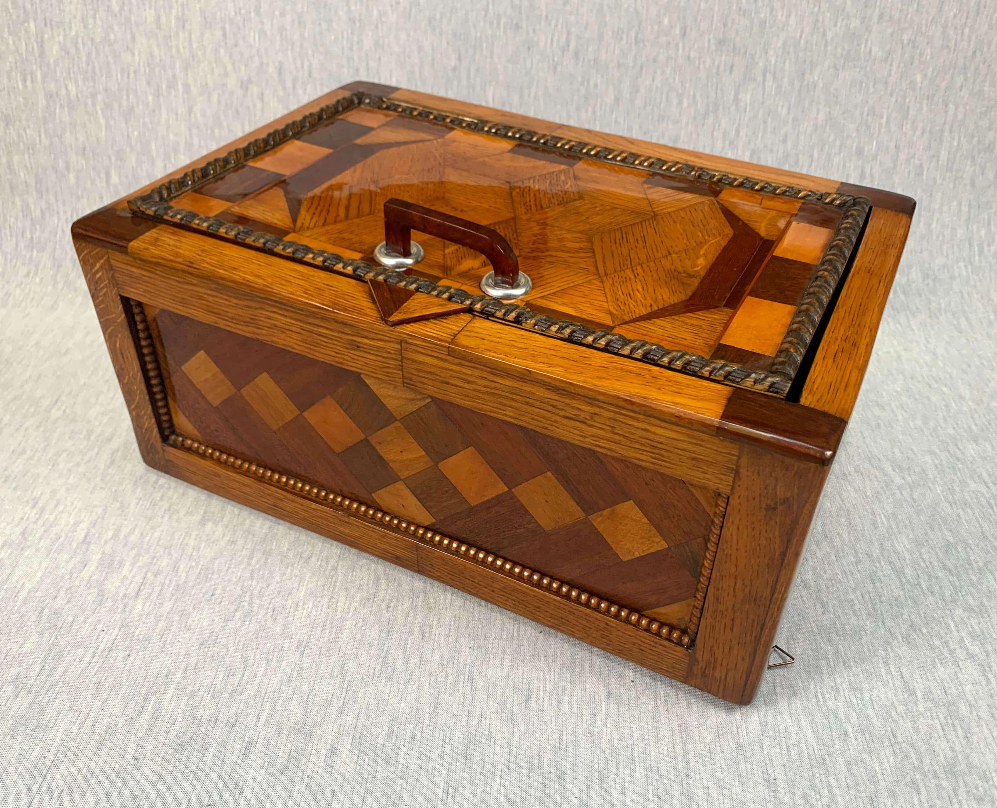 Large historicism box, different hardwoods, South Germany, circa 1860-1880.

Unusual large historicism box / medicine box / hanging cabinet.
Solid oak and cube-shaped veneer with inlays in oak, walnut, rosewood (?) and mahogany.
Lateral: oak,