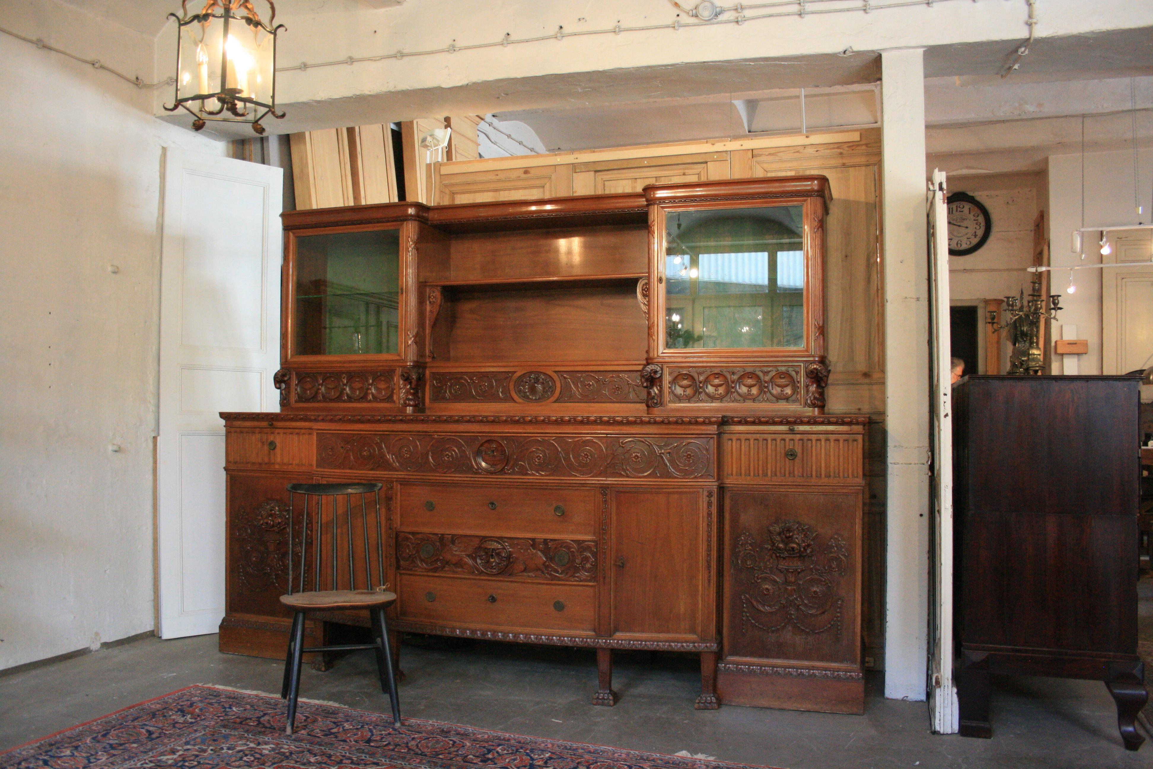 Impressive pomp buffet with monumental dimensions circa from circa 1920, historicism style. 6 doors and 10 drawers plus 2 extension boards. Made of nutwood, partially veneered. To find different influences of several stylistic epochs in