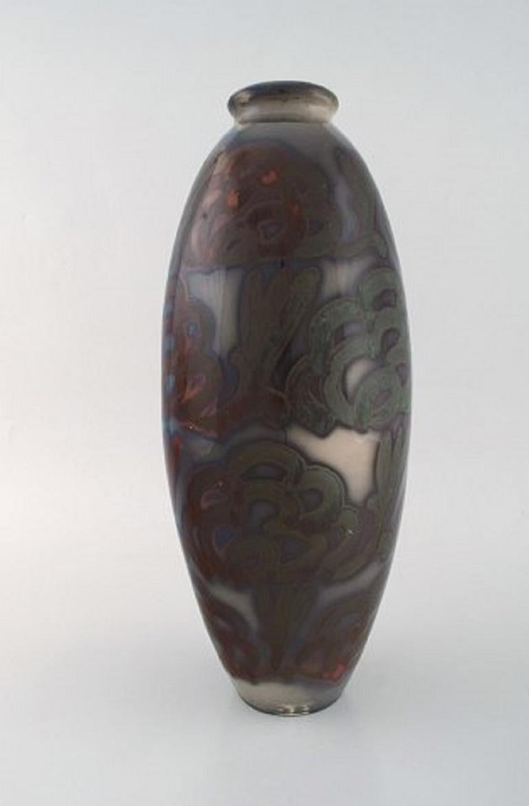 Large Höganäs Art Nouveau vase in glazed ceramics. Beautiful lustre glaze, 1920s-1930s.
Measures: 36.5 x 15 cm.
In very good condition.
Stamped.