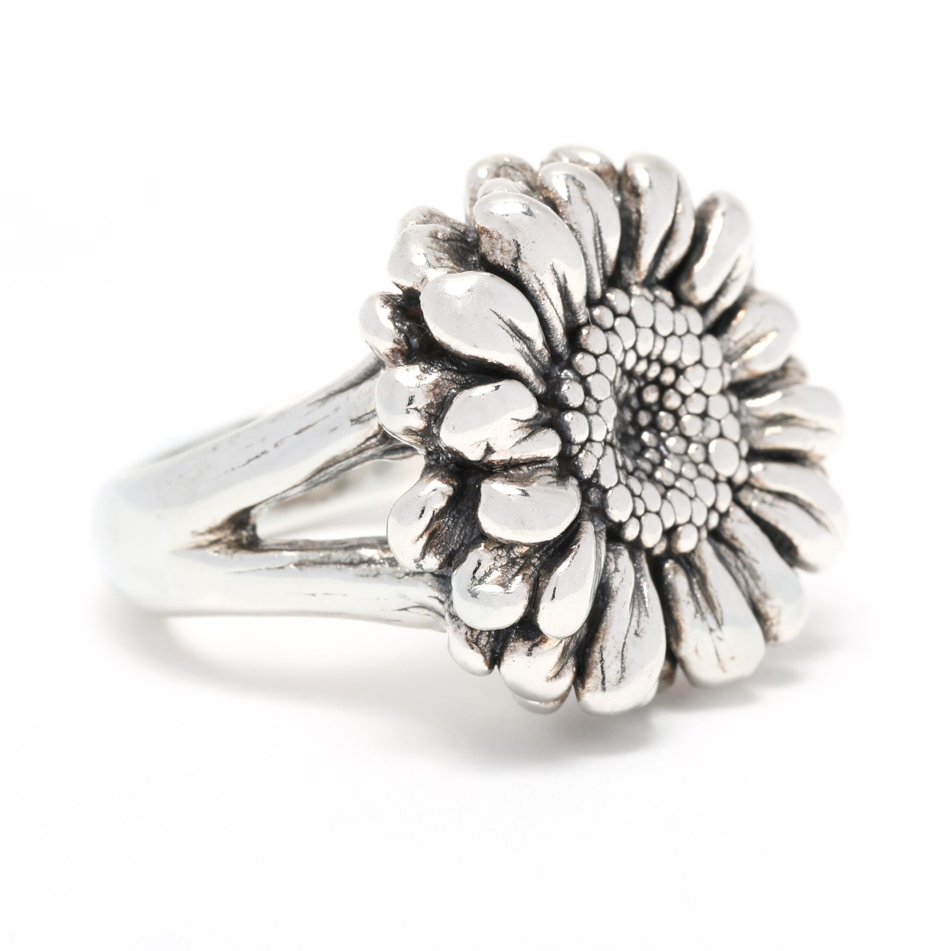 This Large Hollow Sunflower Statement Ring is a beautiful and simple way to add a touch of nature's beauty to any ensemble! Crafted from sterling silver, this ring is designed to look like a sunflower in full bloom. The petals of the flower form a
