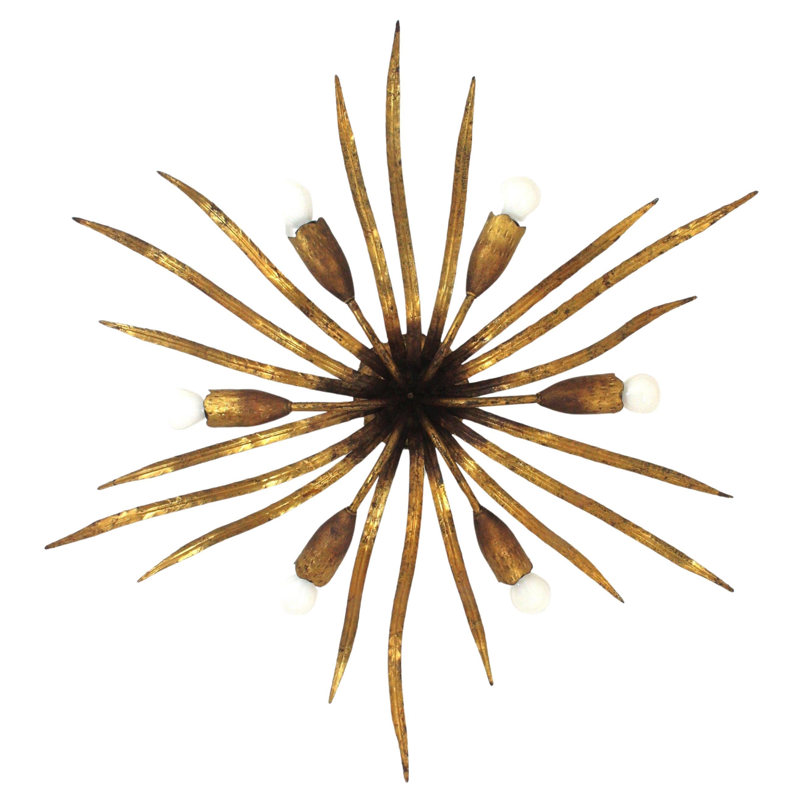 Stunning Six-Light Sunburst leafed Flush Mount / Chandelier in Gilt Iron. 
Manufactured by Ferro Art, Spain, 1940s.
___________________________________________________________________________
Outstanding gilt metal foliage ceiling light fixture with