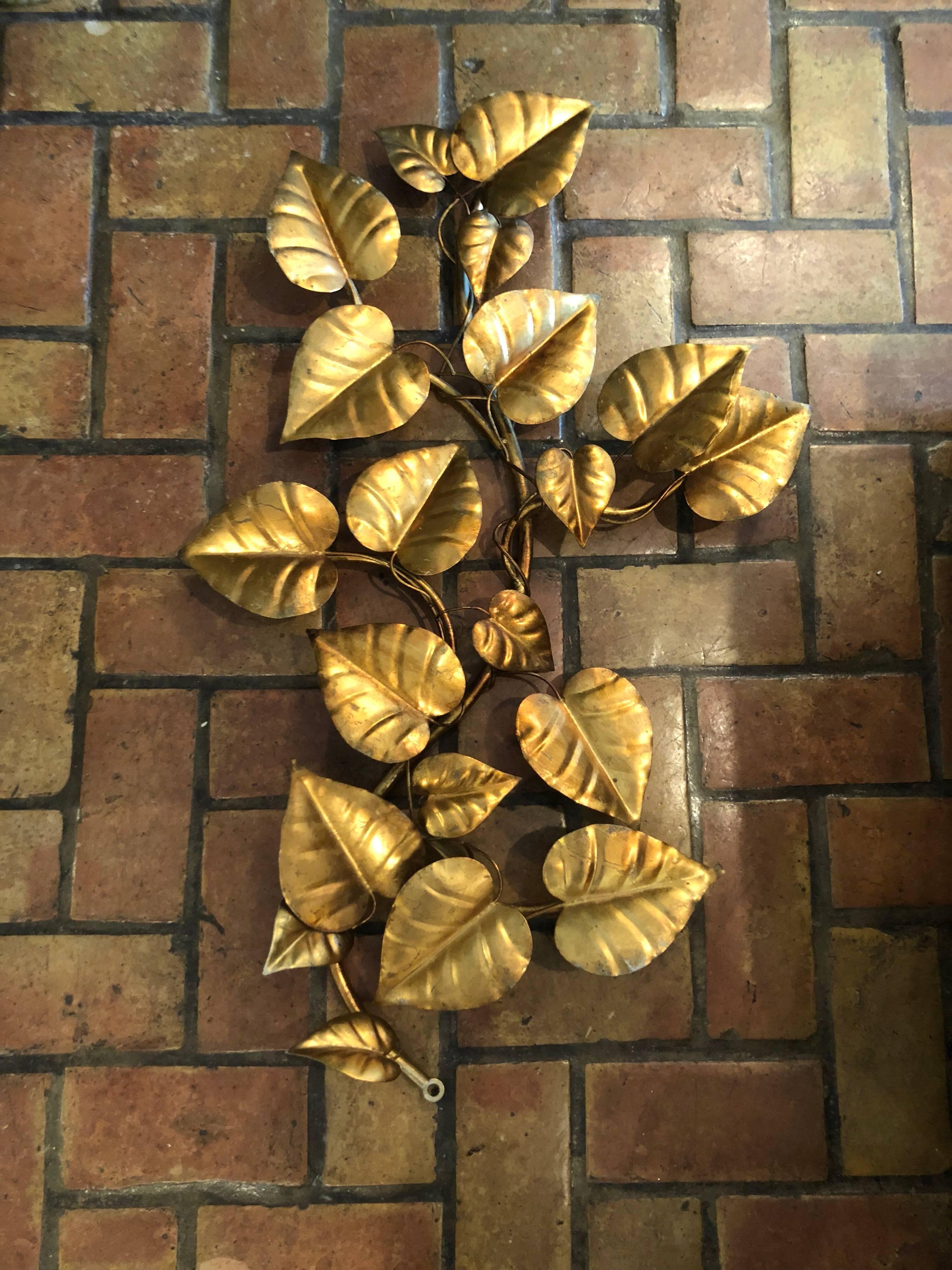 Large Hollywood Regency gilt floral wall hanging. This piece is so Hollywood Regency glam. It will make a dramatic statement in any room. Most likely made in Italy. Easy to hang. This item can parcel ship domestically for $55