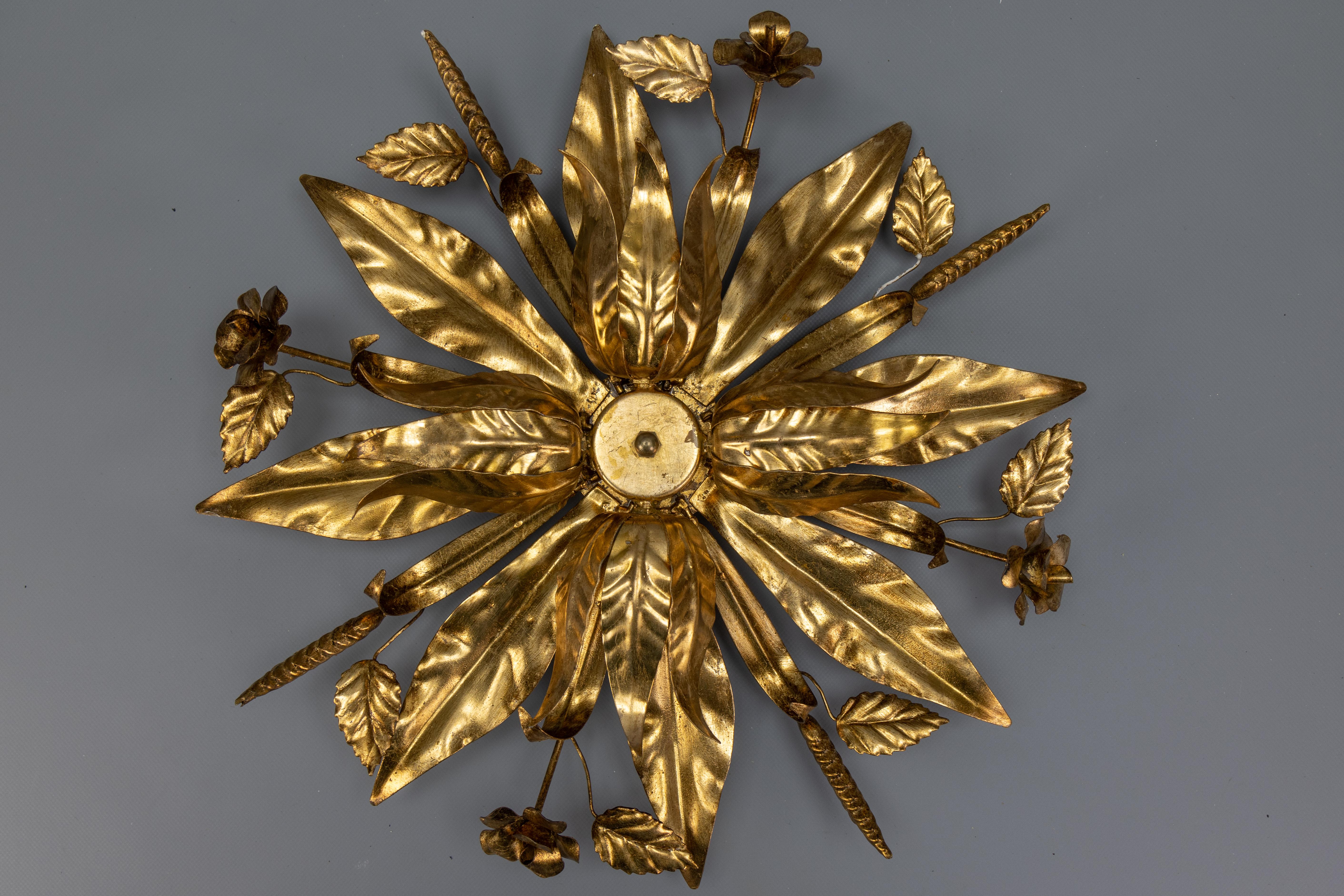 Large Hollywood Regency Gilt Metal Floral Four-Light Flush Mount or Wall Sconce, Attributed to Hans Kögl, circa the 1970s.

This striking and sculptural gilt metal light fixture, attributed to Hans Kögl and dating to the 1970s, exemplifies the
