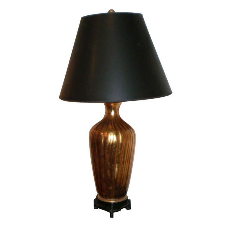 Hollywood Regency Italian midcentury gold glass lamp on iron base by Marbro.
Large scale Italian gold blown glass on interesting Asian Modern iron base. This high quality Hollywood Regency glass lamp was made by Marbro. Shade in photo not included.