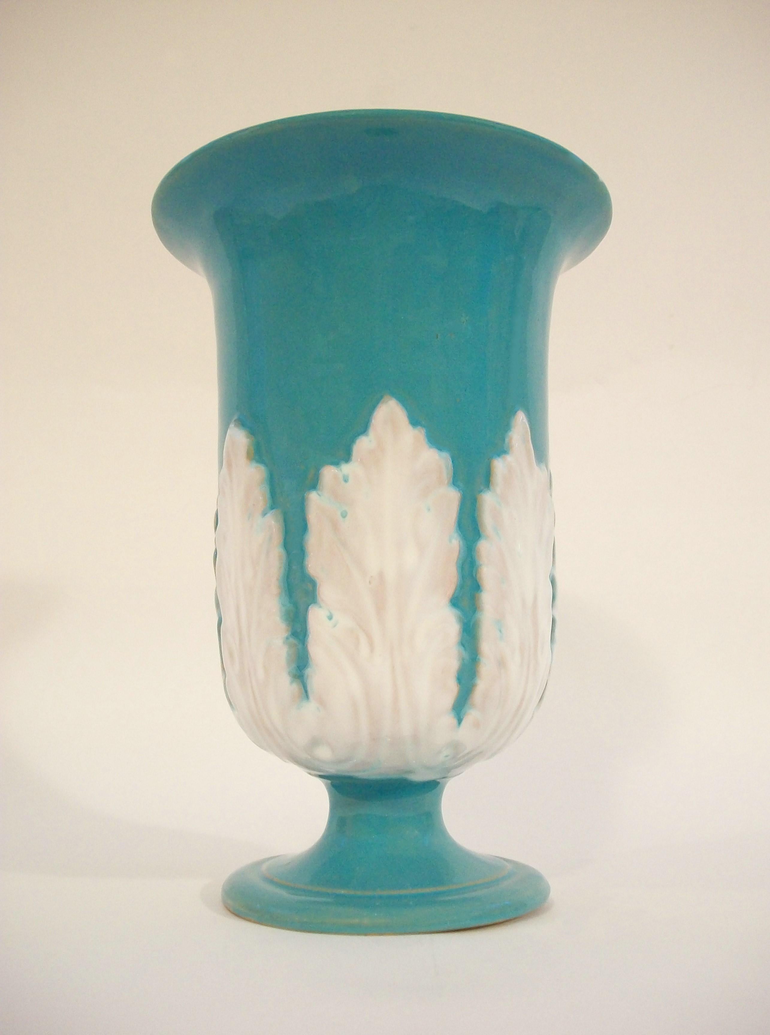 Large Hollywood Regency turquoise glazed trumpet shaped terracotta vase - featuring white glazed acanthus leaves to the mid section - tapered socle base - glazed interior - unsigned - model number 4021.90 and Italy to the bottom - circa