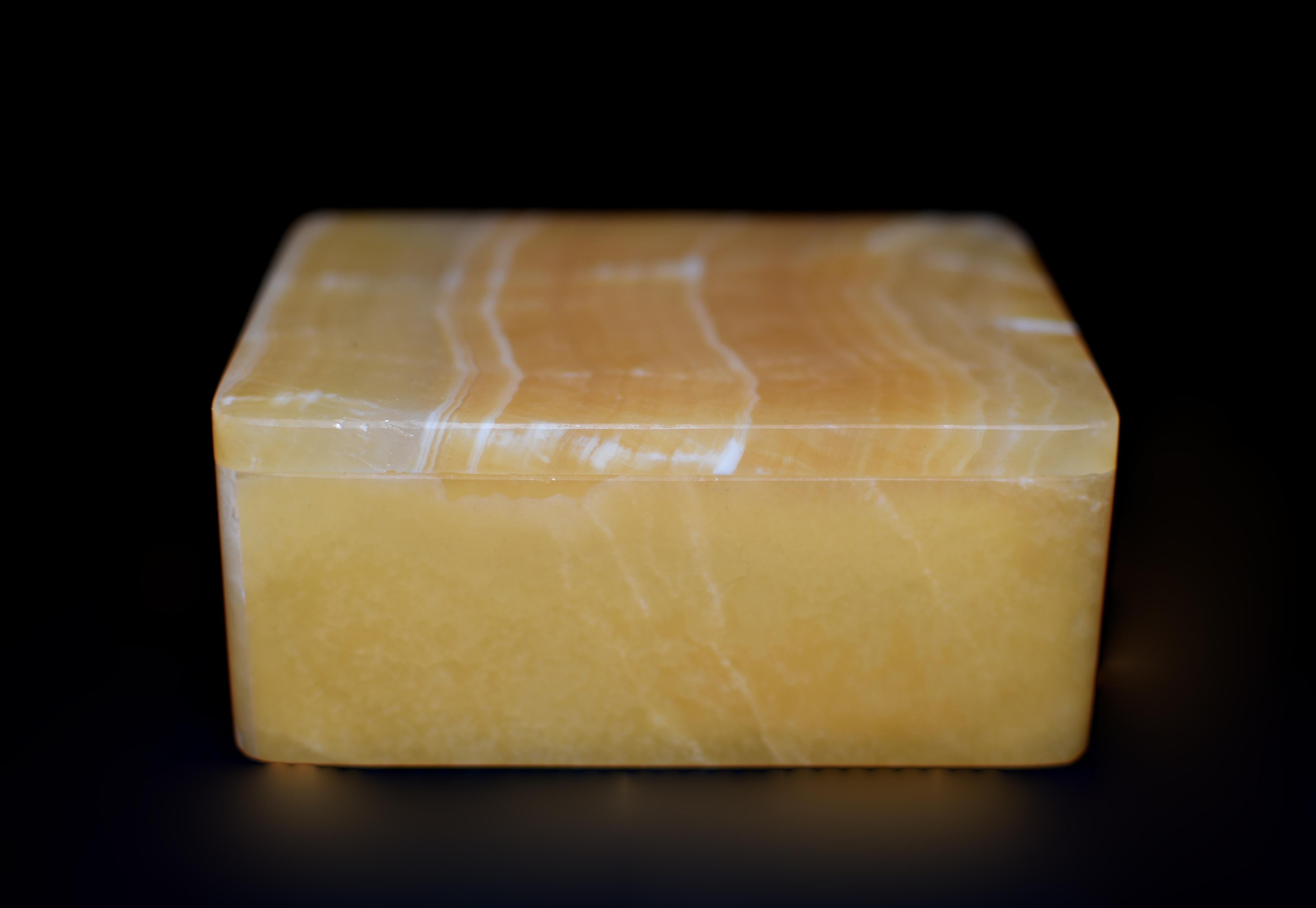 This exquisite 1.2-lb creation is crafted from the finest rare honey calcite onyx sourced from Pakistan. Hand made by a master artisan in Italy, showcasing beautiful patterns and bands that are distinctively unique to calcite onyx.  Lustrous, warm