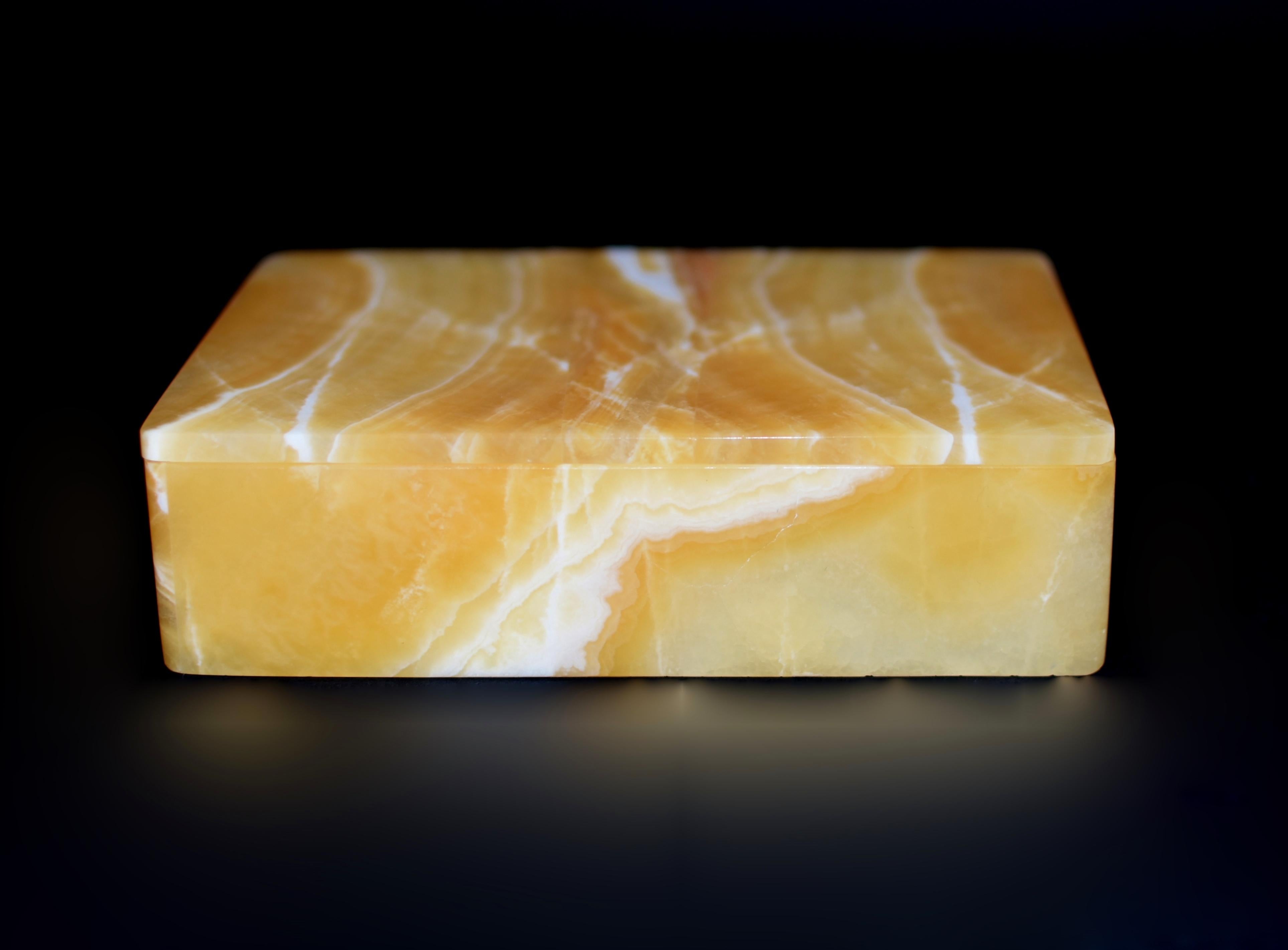 This exquisite 2-lb creation is crafted from the finest rare honey calcite onyx sourced from Pakistan. Hand made by a master artisan in Italy, showcasing beautiful patterns and bands that are distinctively unique to calcite onyx.  Lustrous, warm