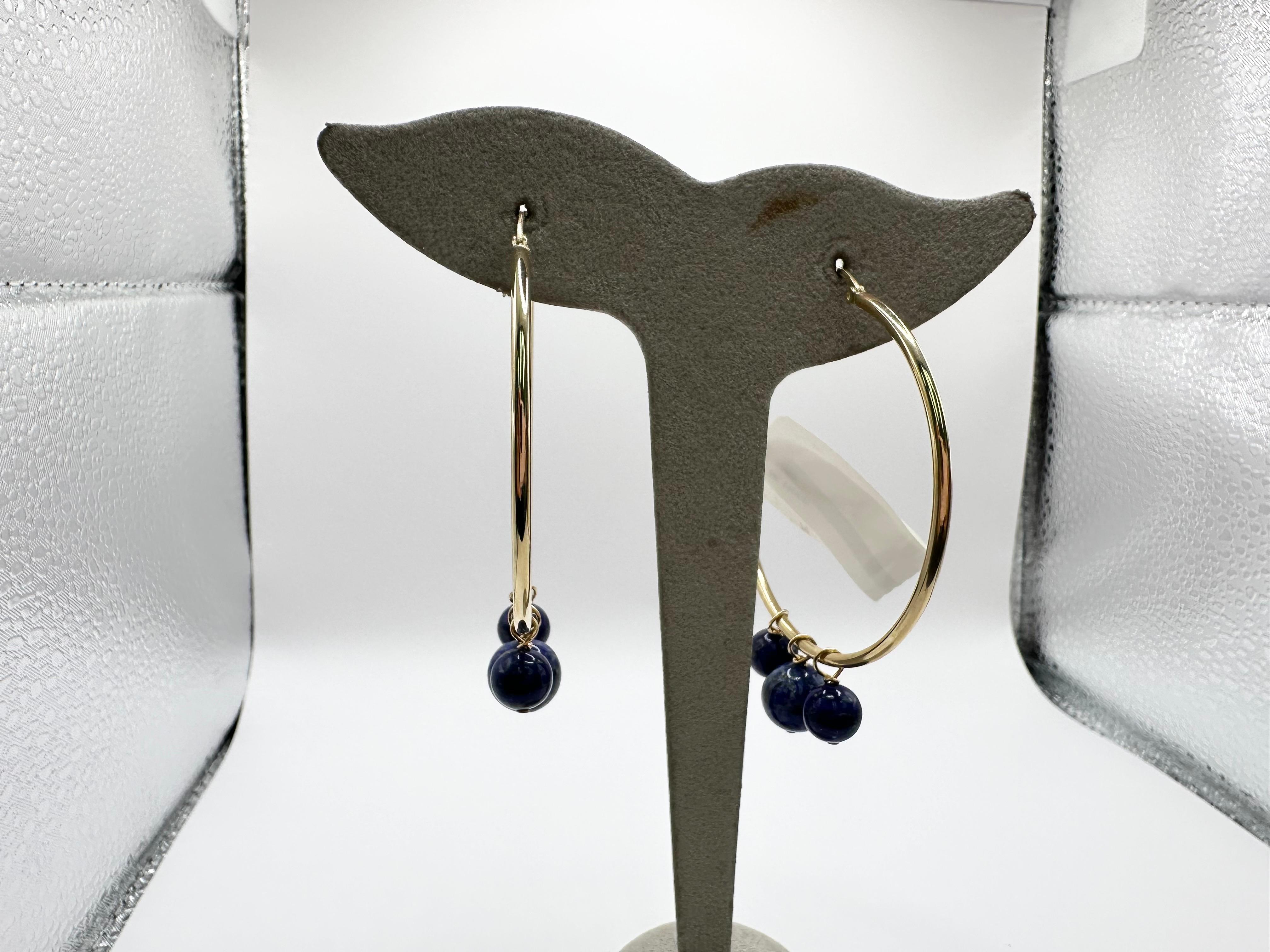 Stunning hoop earrings made with 14KT gold, beautiful lapis lazuli beads complete these dangling beauties!

Metal Type: 14KT

Natural Gemstones: lapis lazuli
Certificate of authenticity comes with purchase!

ABOUT US
We are a family-owned business.