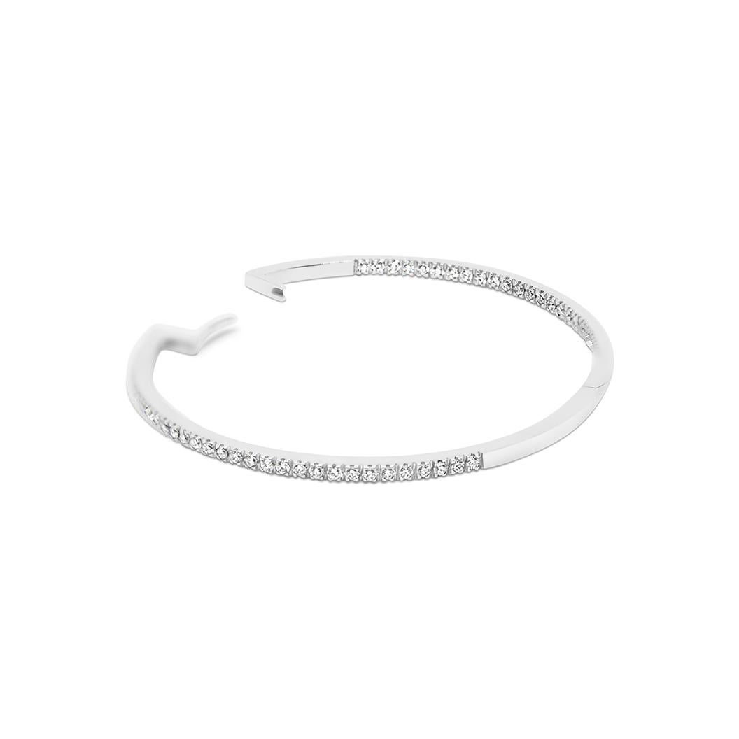 A classical and timeless piece, both precious and sustainable. A minimalistic design made of recycled white gold, set with white natural diamonds pave.
SI1 White Diamonds: 118 stones, round 1.70 mm
Metal: 9k recycled white gold 
Finish: high