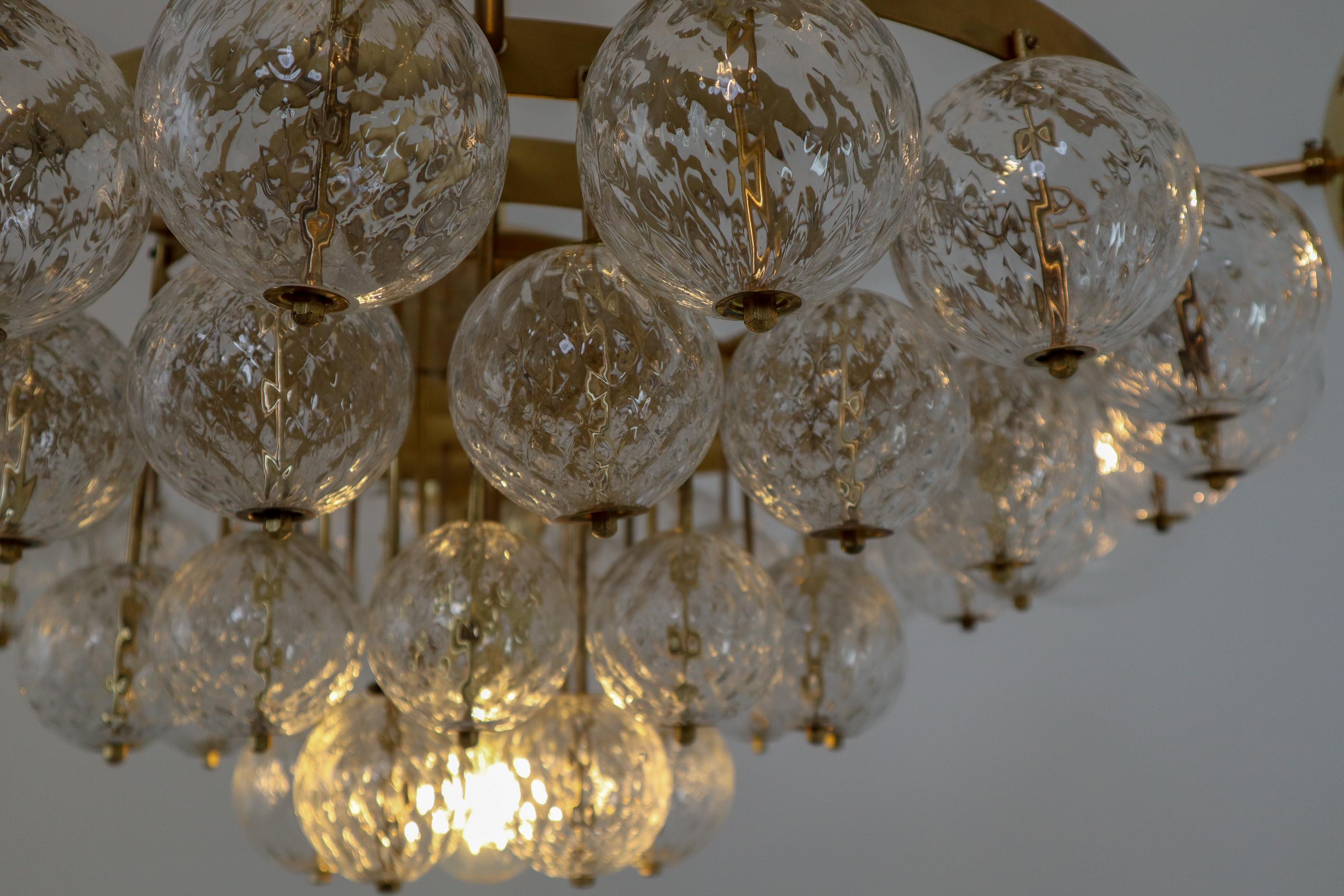 20th Century Large Hotel Chandeliers with Brass Fixture and Structured Glass Globes For Sale