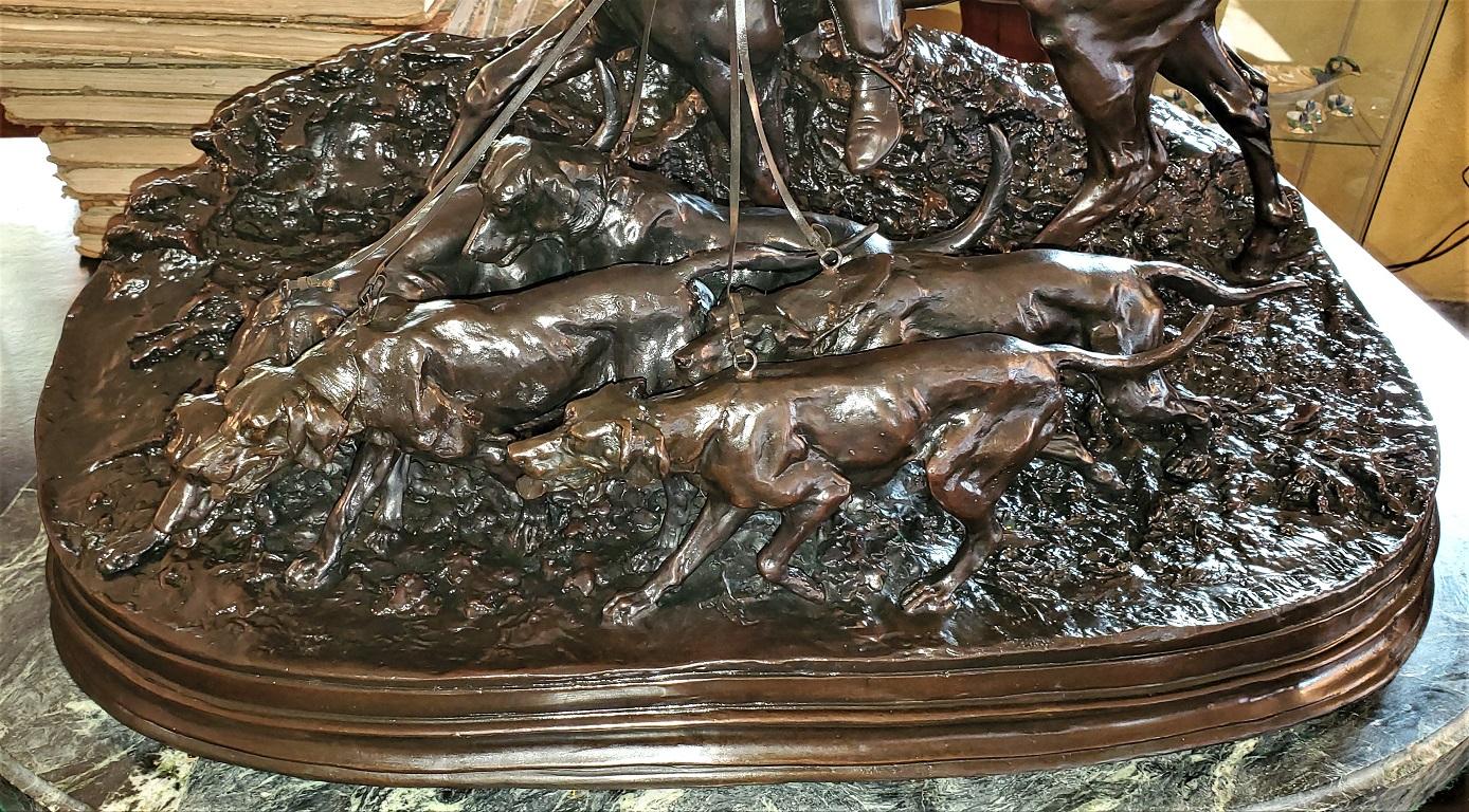 Presenting an absolutely stunning large Huntsman with his hounds bronze sculpture by PJ Mene 1869.

This is a large sculpture weighing over 175 lbs.

It features a French Huntsman mounted on his horse with 5 hounds on individual leashes. They are on