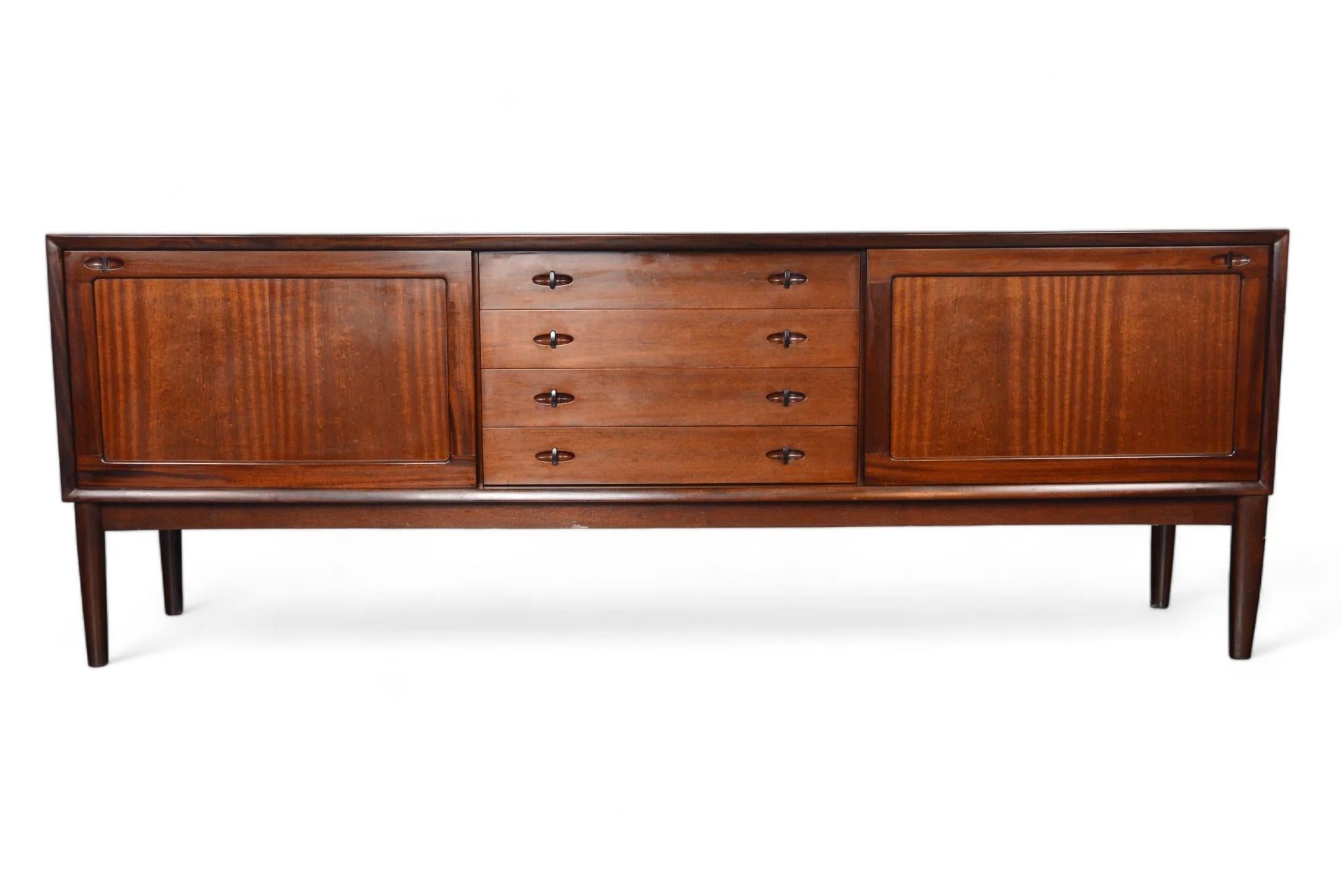 Origin: Denmark
Designer: H.W. Klein
Manufacturer: Bramin
Era: 1960s
Materials: Mahogany
Measurements: 88.5″ wide x 18″ deep x 32″ tall
Condition: In excellent original condition with typical wear for its vintage.

Price includes restoration /