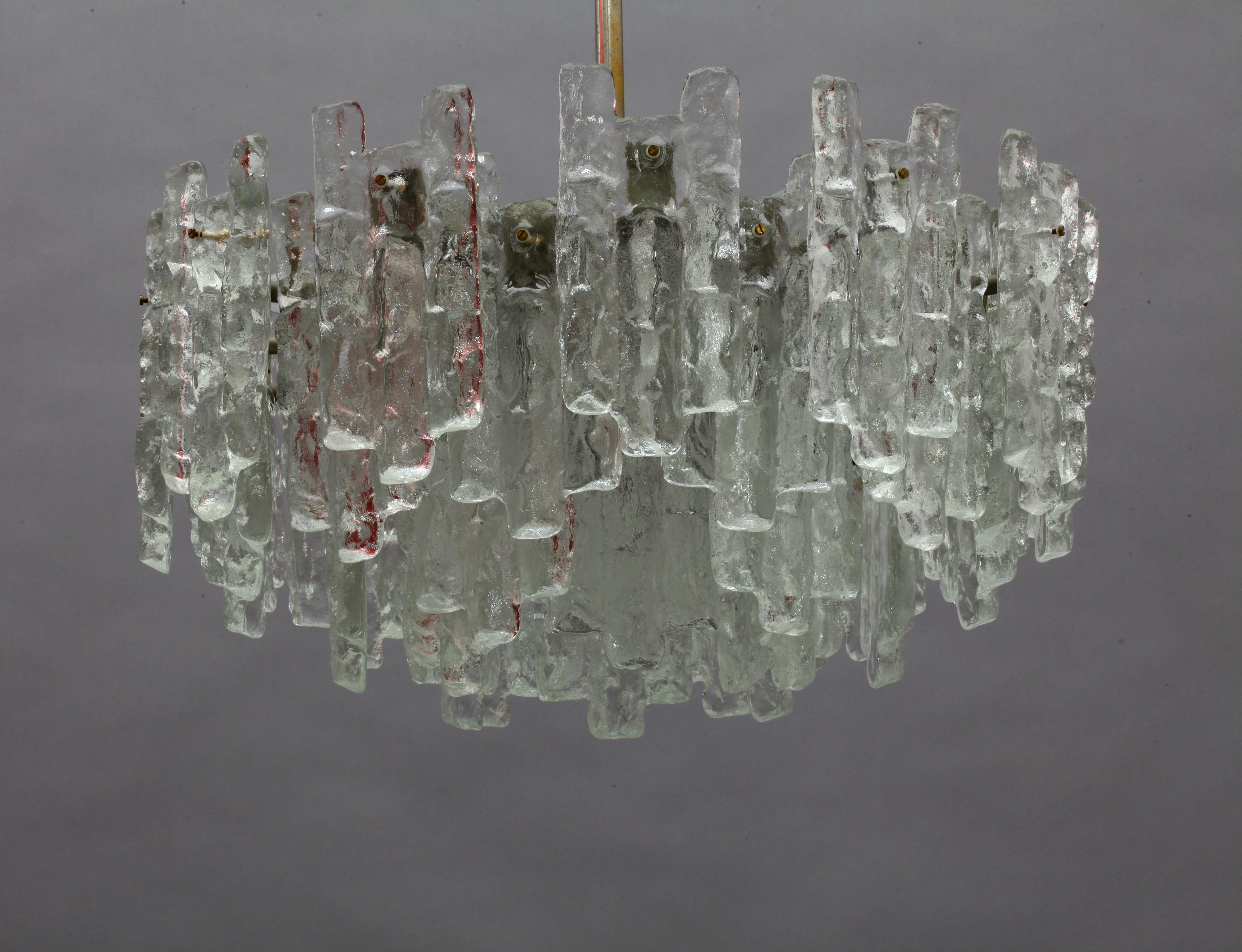 Extra large light fixture model 'SORIA' by Kalmar, Austria, manufactured in midcentury, circa 1960 (late 1960s-early 1970s). These chandeliers are the largest version of this series.

A silver painted metal frame holds 48 large textured and
