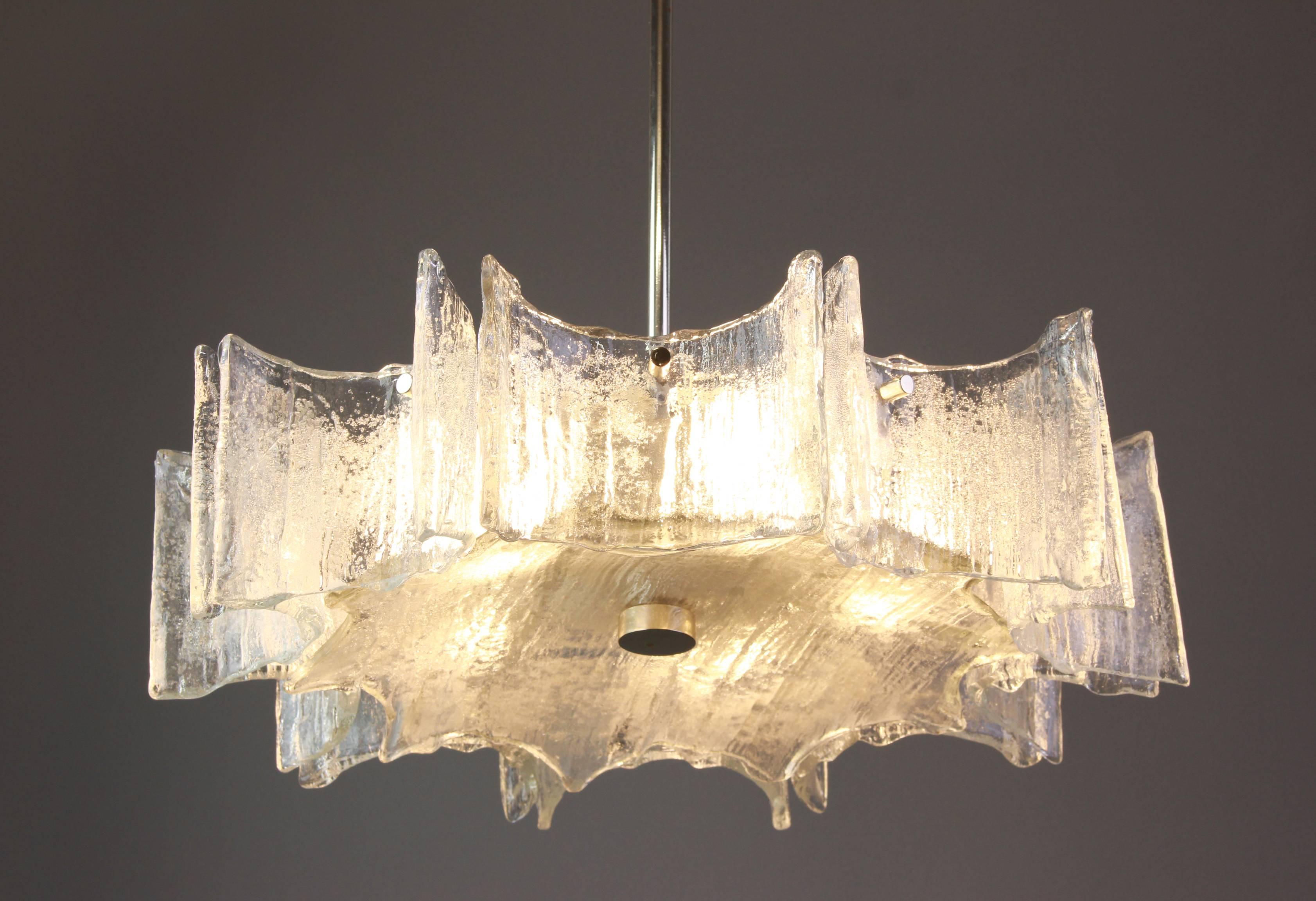 Fantastic star shape chandelier by Kaiser, Germany, manufactured, circa 1960 -1969. Curved Murano glasses suspended from a fixture.

Sockets: Five x E27 Standard bulbs (max. 60 watt each)
Light bulbs are not included. It is possible to install this