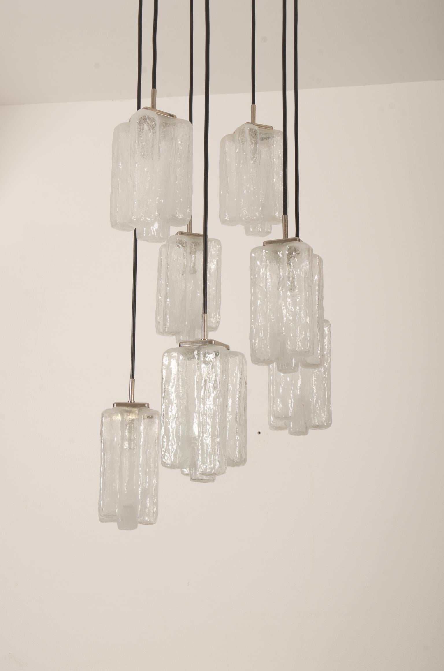 Beautiful chandelier made of nickel-plated brass holders with seven hand blown glass shades, each fitted with E14 sockets. Made by. J.T. Kalmar in the 1970s.