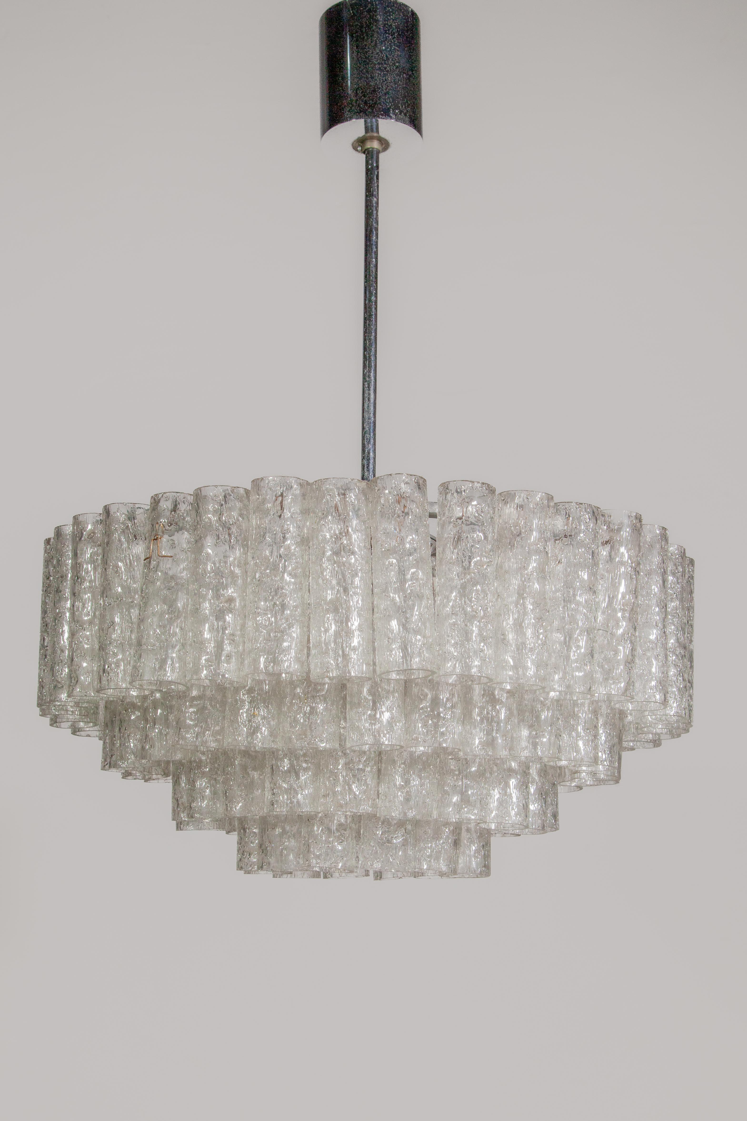 Original 4 tiers iced glass tubes Chandelier designed by Doria luchten, 1960s, Germany.
In original good condition with some signs of use. A nice warm light for your interior.
Also other types of Doria chandeliers available!

Doria-Werkstätten,