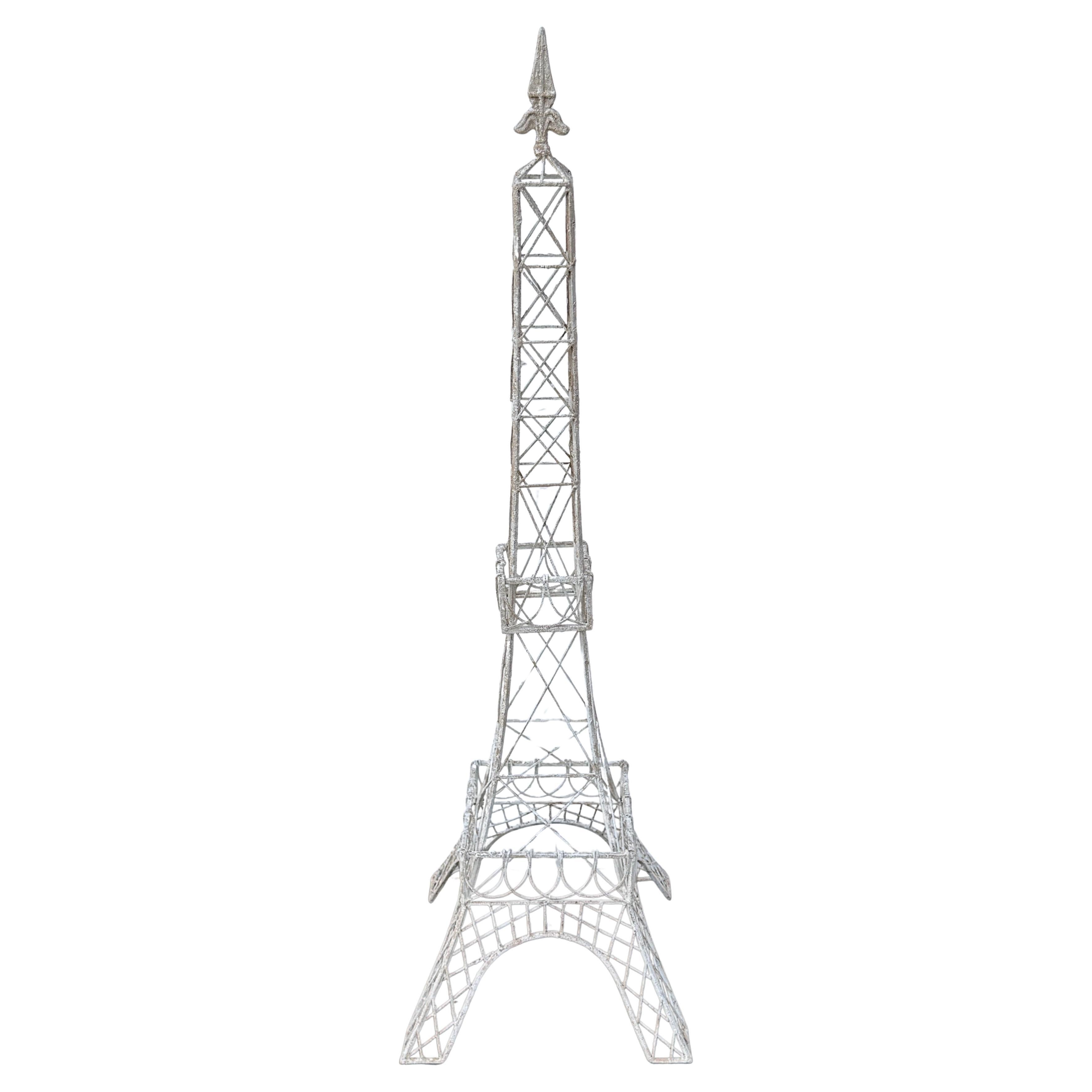 This oversized wire Eiffel Tower makes an impressive statement wherever displayed. This eye-catching fragment, hand-painted in creamy white, certainly would be a wow factor in a home on a table or retail setting as a window display. 