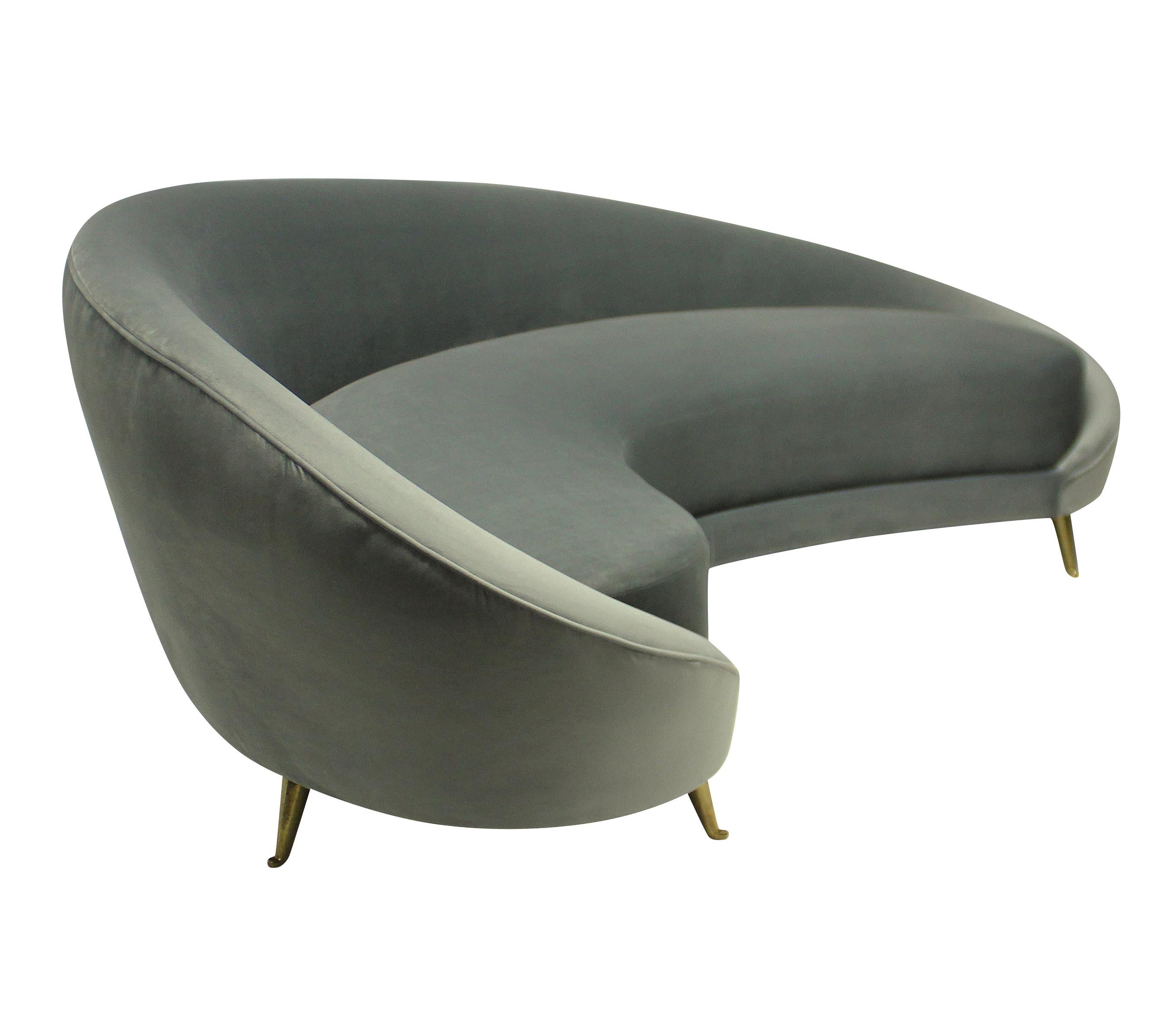 A large Italian curved asymmetrical sofa in the style Ico Parisi, on brass feet by ISA, and newly upholstered in grey silk velvet.