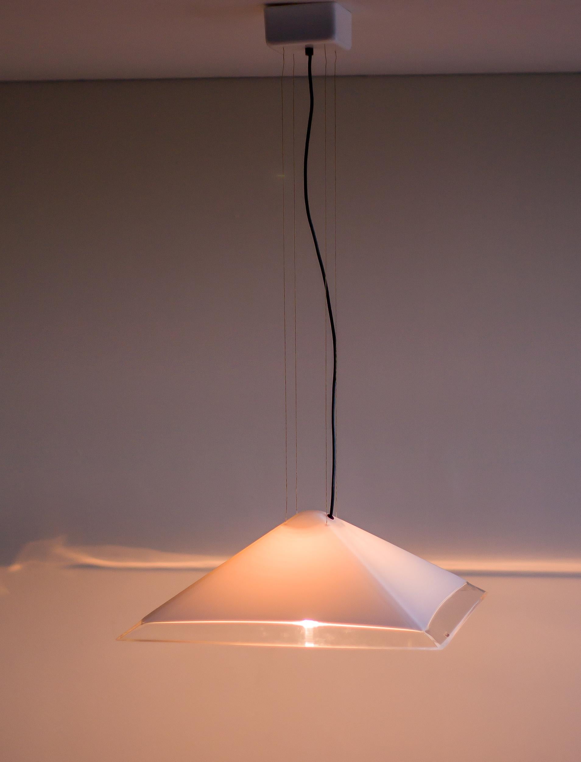 IGuzzini height adjustable pyramid shaped pendant in white plexiglass with translucent edges.
Also suitable for a sloping ceiling.
Italian 1980s modern design at its best, marked with label.

Having treasures in one’s historical archives and being