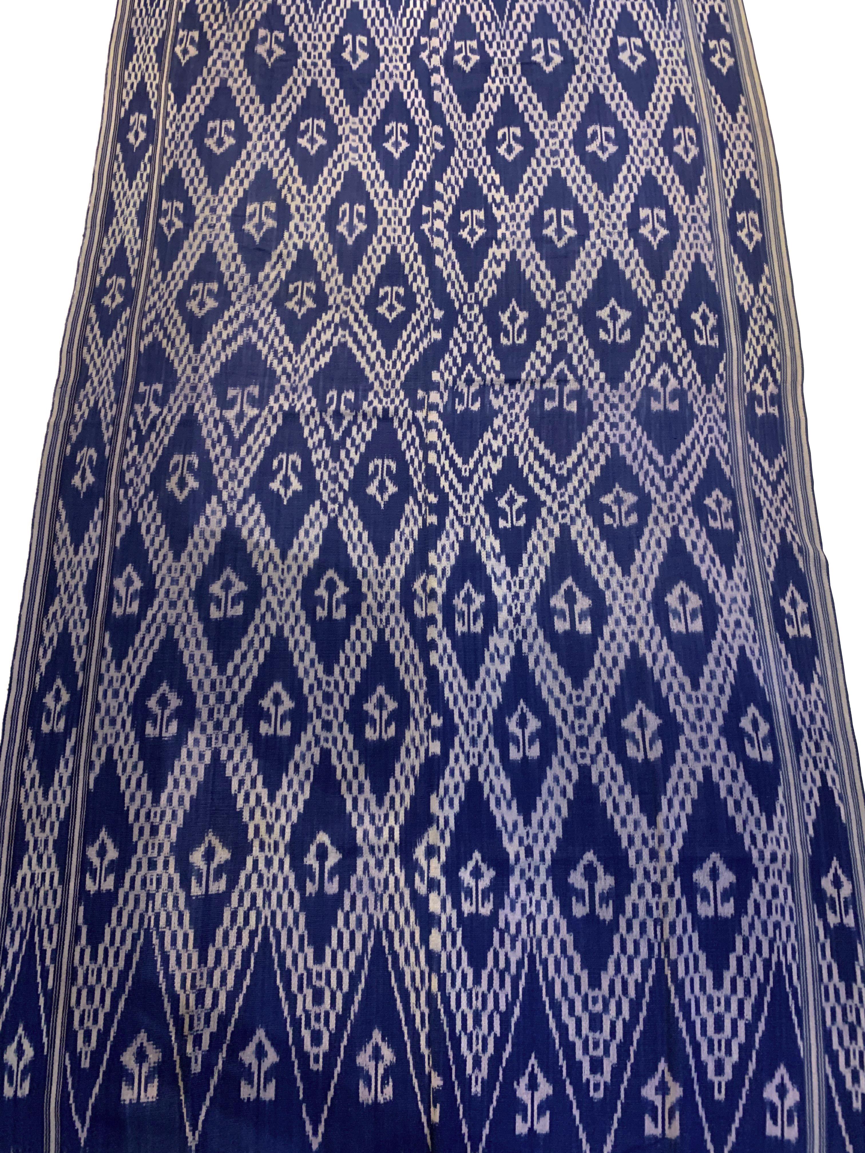 This Ikat textile originates from the Island of Sumba, Indonesia. It is hand-woven using naturally dyed yarns via a method passed on through generations. It features a stunning array of tribal patterns and motifs. It is the women of Sumba who are