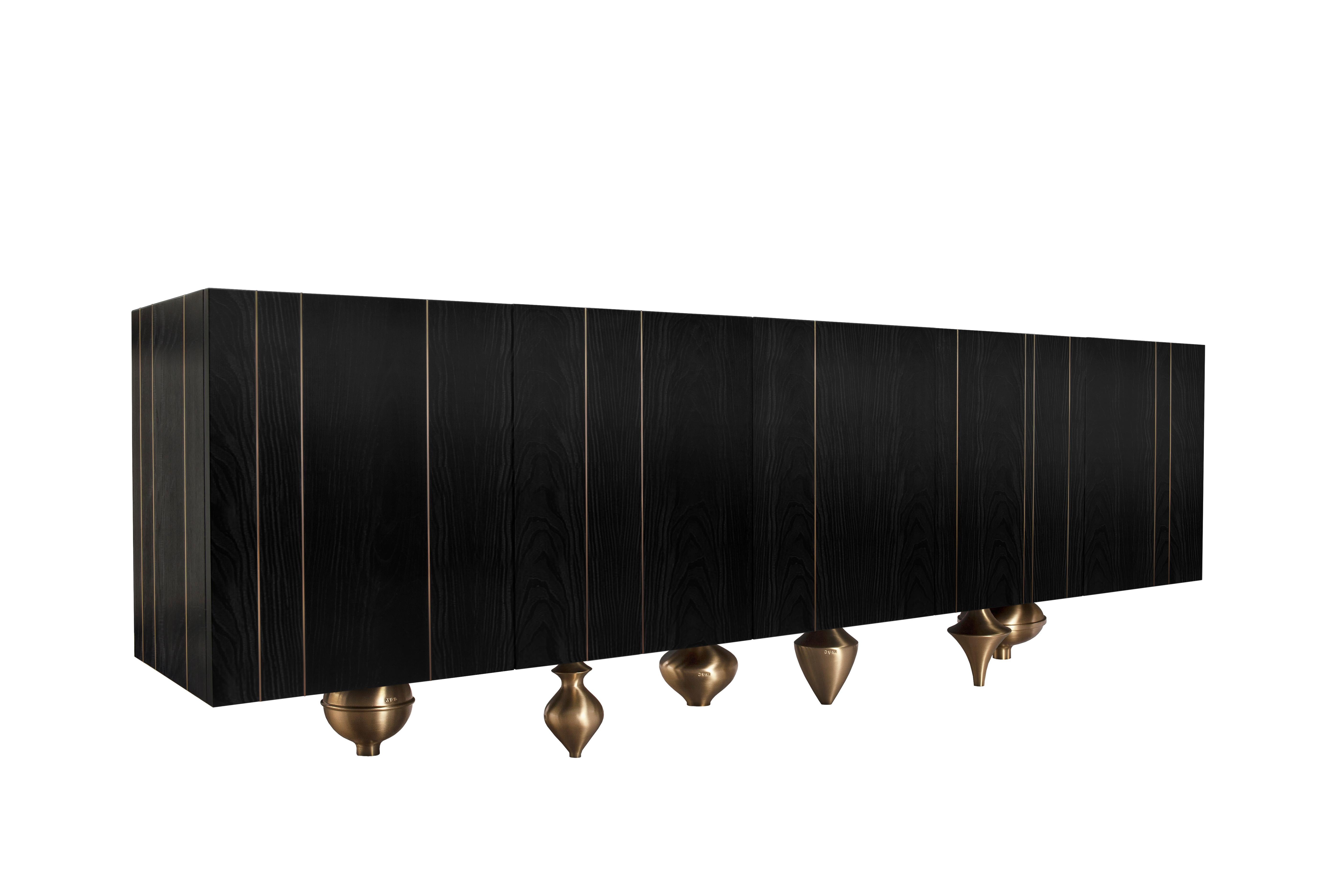 Large Il Pezzo 1 Black Credenza by Il Pezzo Mancante
Dimensions:  W 255 x D 83 x H 40 cm
Materials: Structure: black stained oak. Base: gold, satin brass, bronze, nickel. Top: black marquinia marble. 
Weight: approx 140 Kg

An alternation of rounded