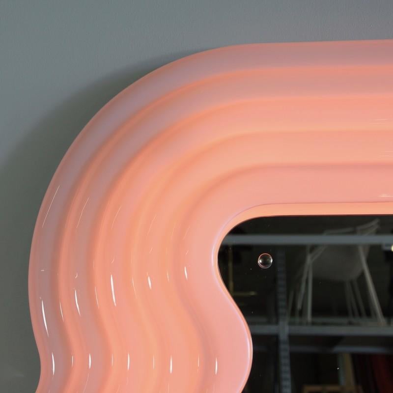 Ultrafragola mirror, designed by Ettore Sottsass, Italy, 1970.

Recent production mirror made of moulded fibreglass with wooden back and shaped mirror. The frame is white, turning pink when neon light is switched on.

               