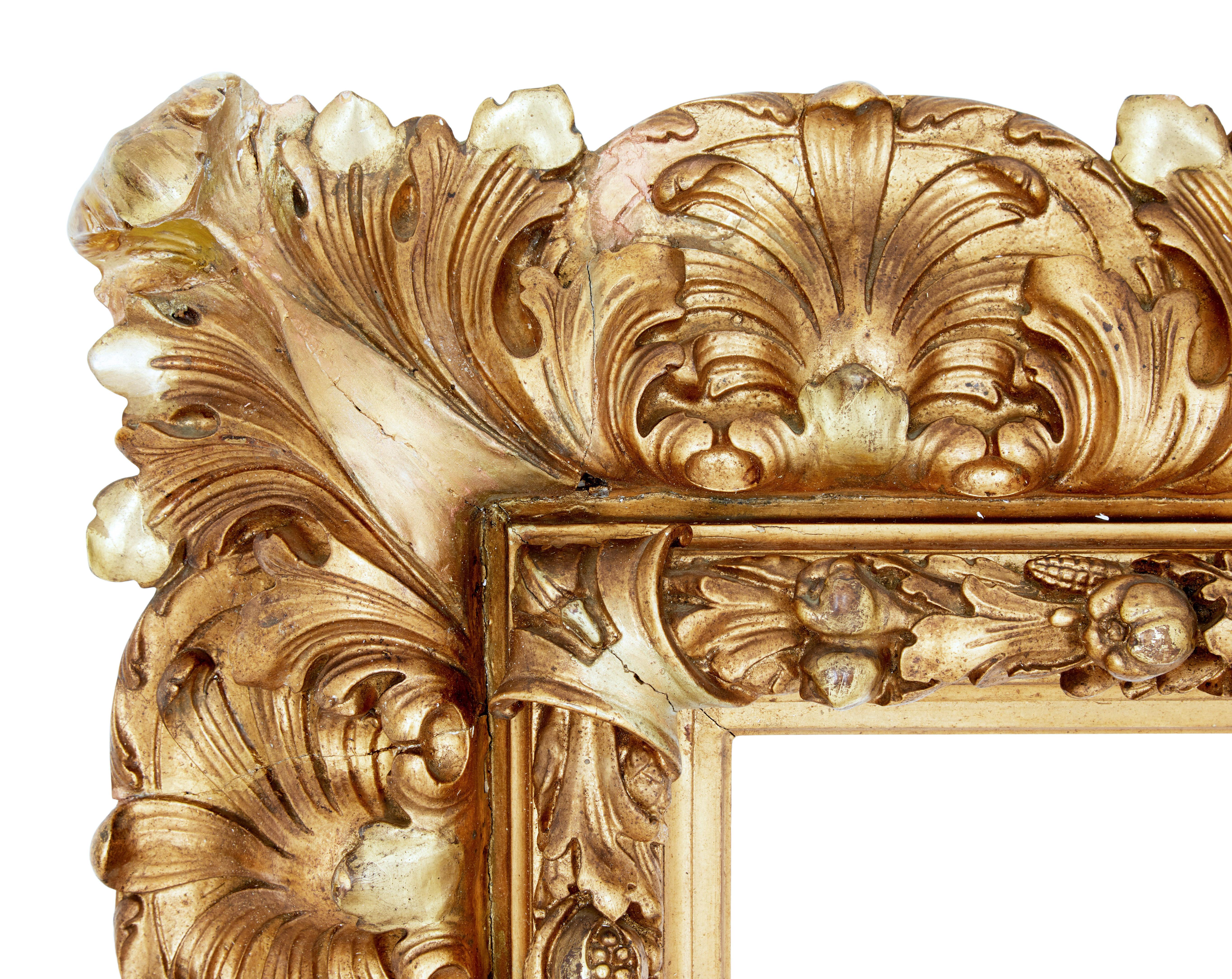 Large impressive 19th century Rococo revival gilt frame, circa 1890

Great opportunity to turn this decorative frame into a fantastic wall decoration. Inner slip with carved pods and leaves surrounded by scrolling leaves on the