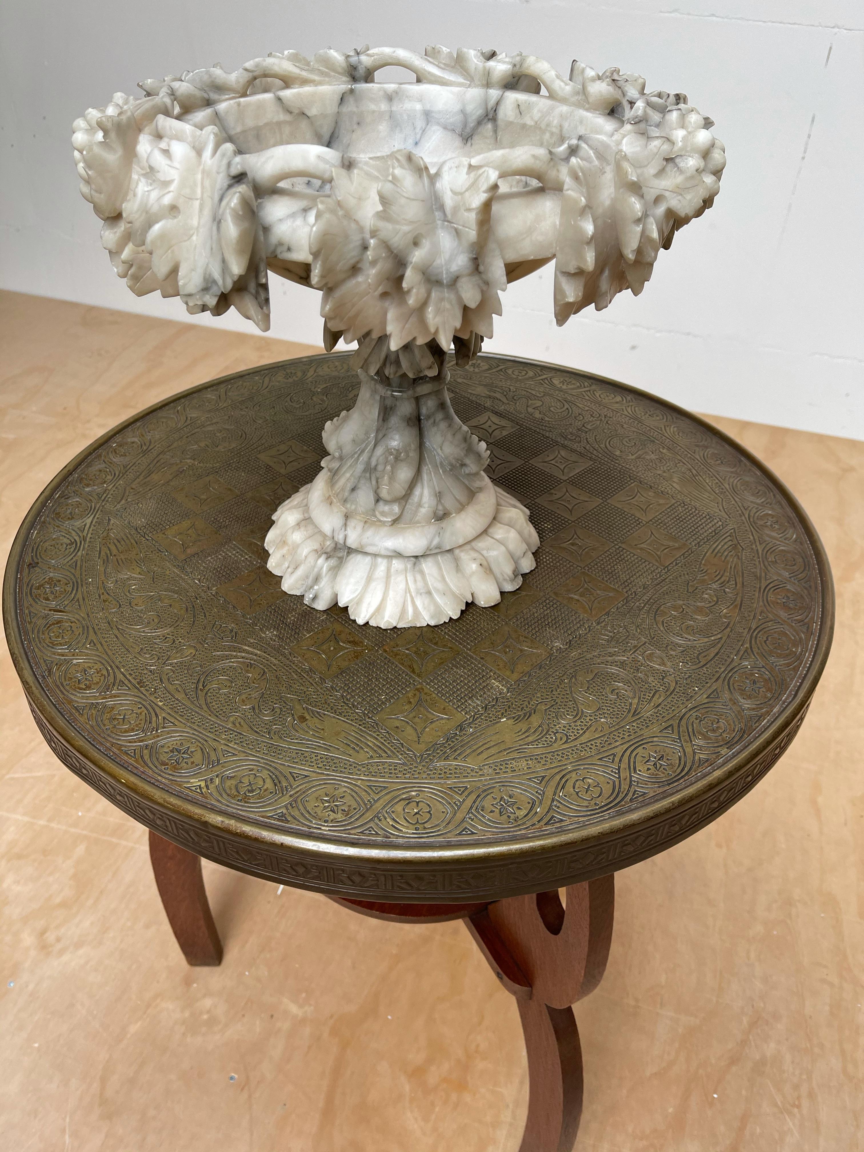 Rare and impressive work of sculptural art.

All handcrafted out of alabaster this stylish and decorative tazza makes a great centrepiece. Have you ever tried to hand carve a figure out of a piece of natural mineral stone? Only than you can really